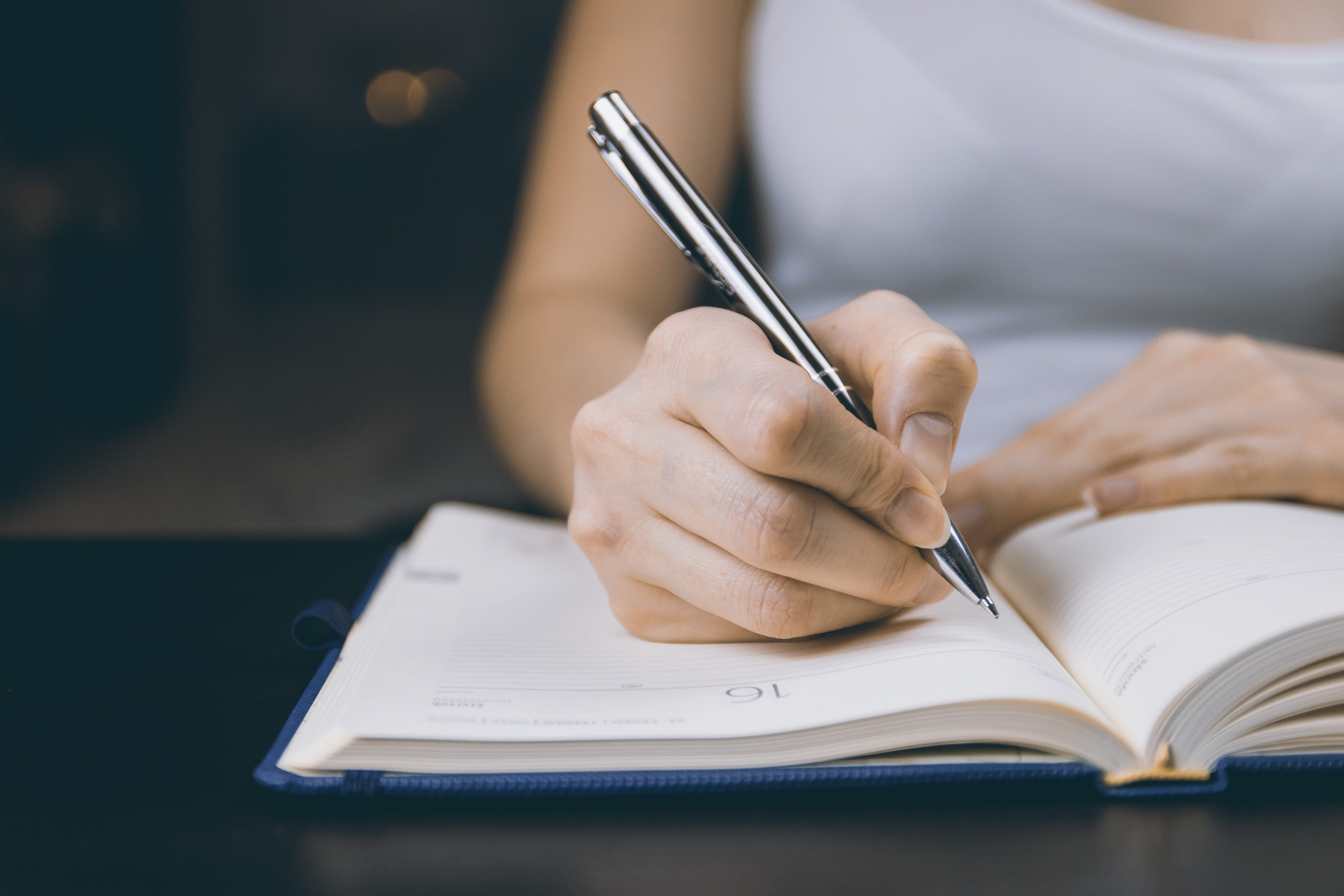 ballpen, person, one person, holding, education, hands, human body part, lady, notebook, girl, human hand, focus on foreground, table, publication, studying, HD Wallpaper