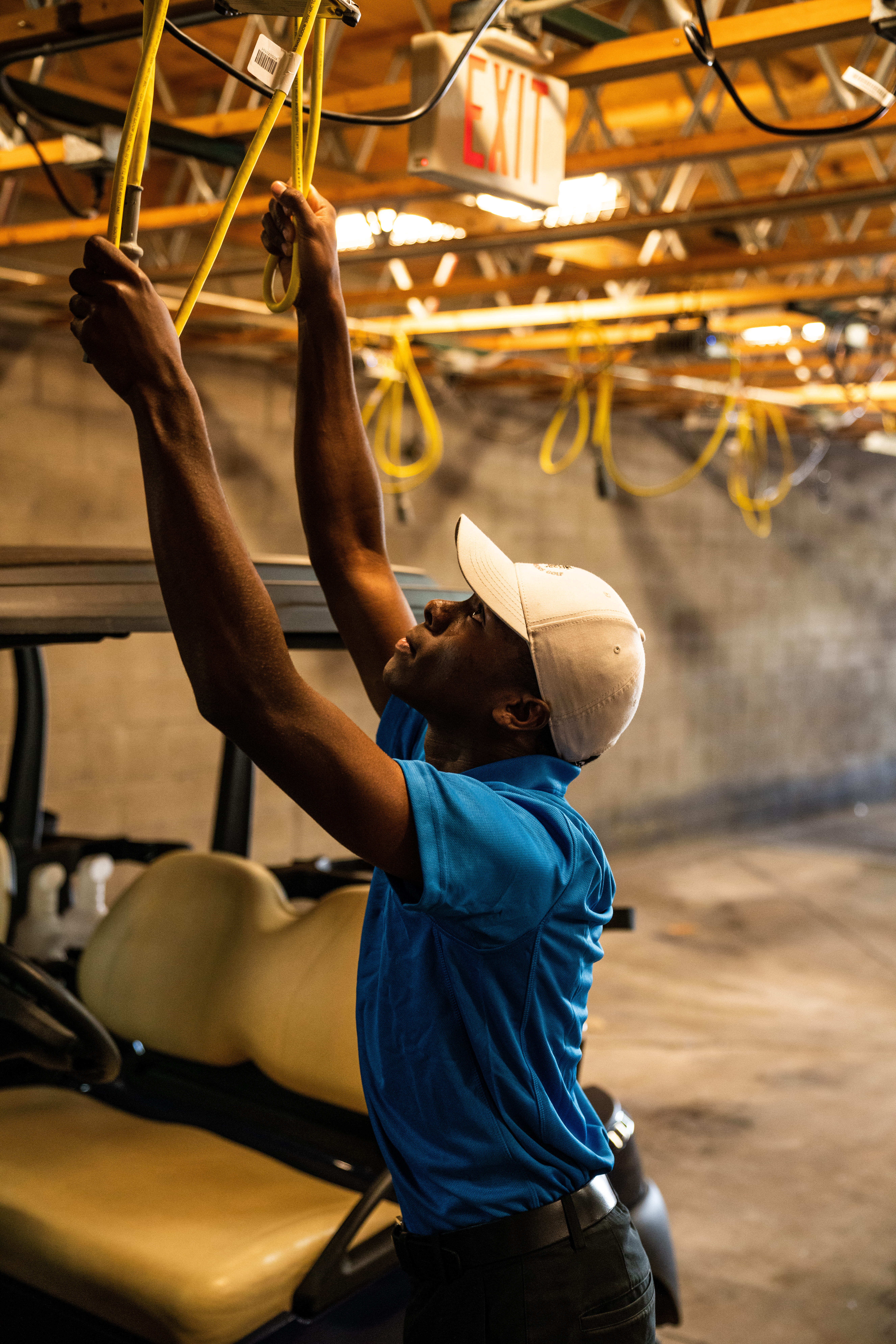 white, worker, clothing, day, men, blur, garage, males, cap, young adult, person, work, casual clothing, man, golf cart, sitting, golf, adult, hat, transportation, Phone HD Wallpaper