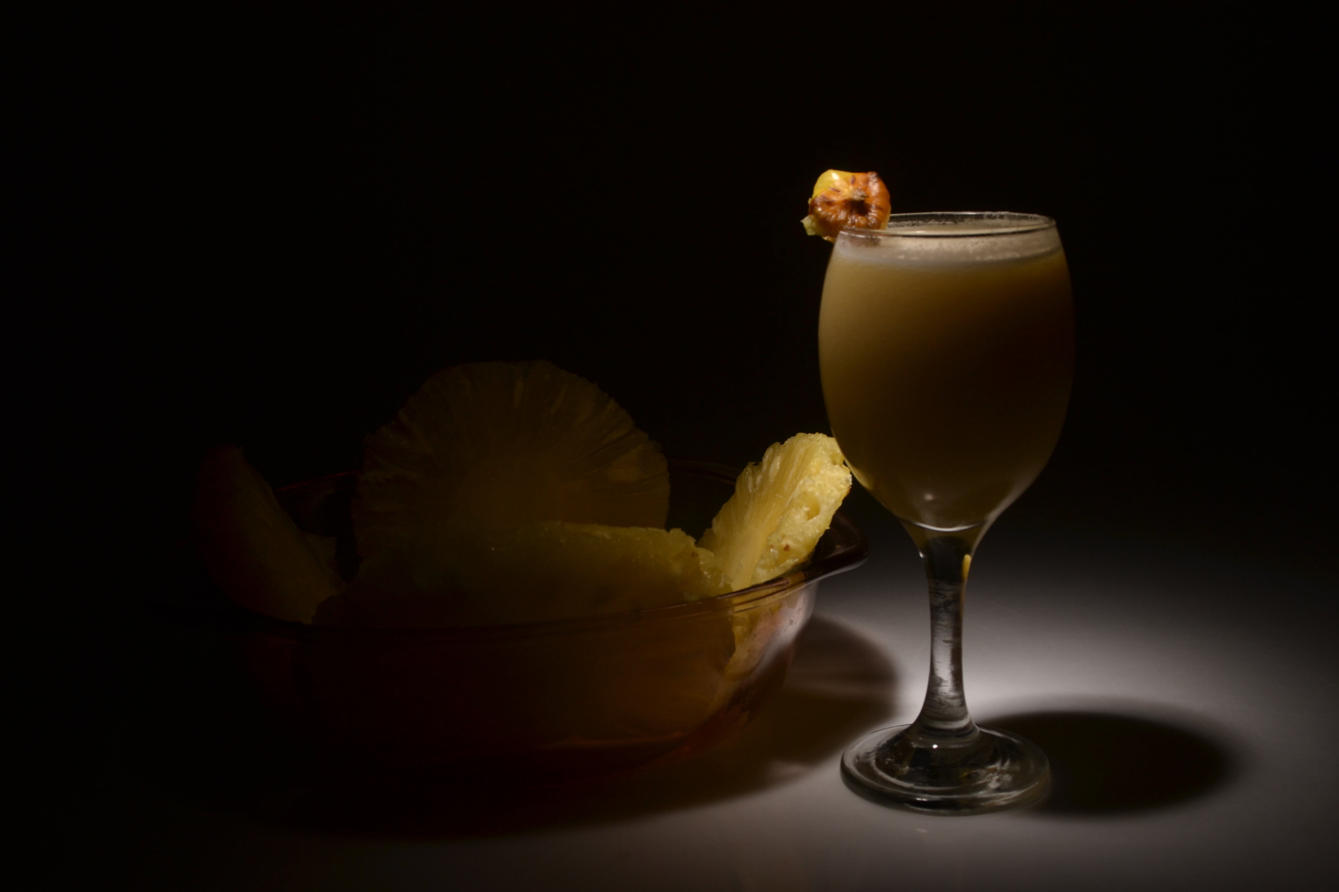 indoors, dessert, drinking glass, drink, refreshment, food and drink, pineapple, 4K, luxury, fruit, freshness, food, glass, indulgence, still life, black background, HD Wallpaper