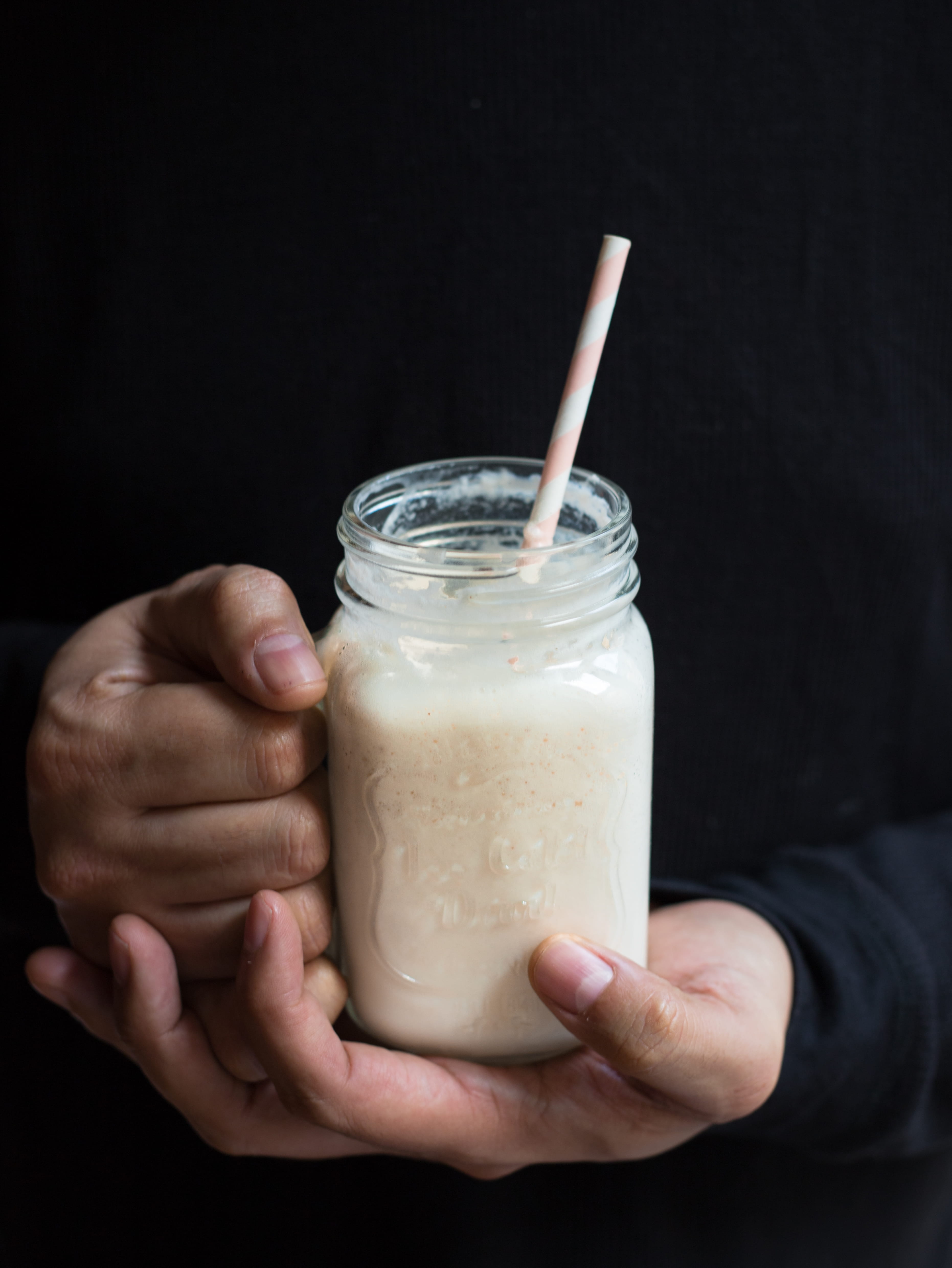 hand, glass, filled, clear, healthy, drink, refreshment, graviola, drinking glass, human hand, food photography, black background, mason jar, drinking straw, Phone HD Wallpaper