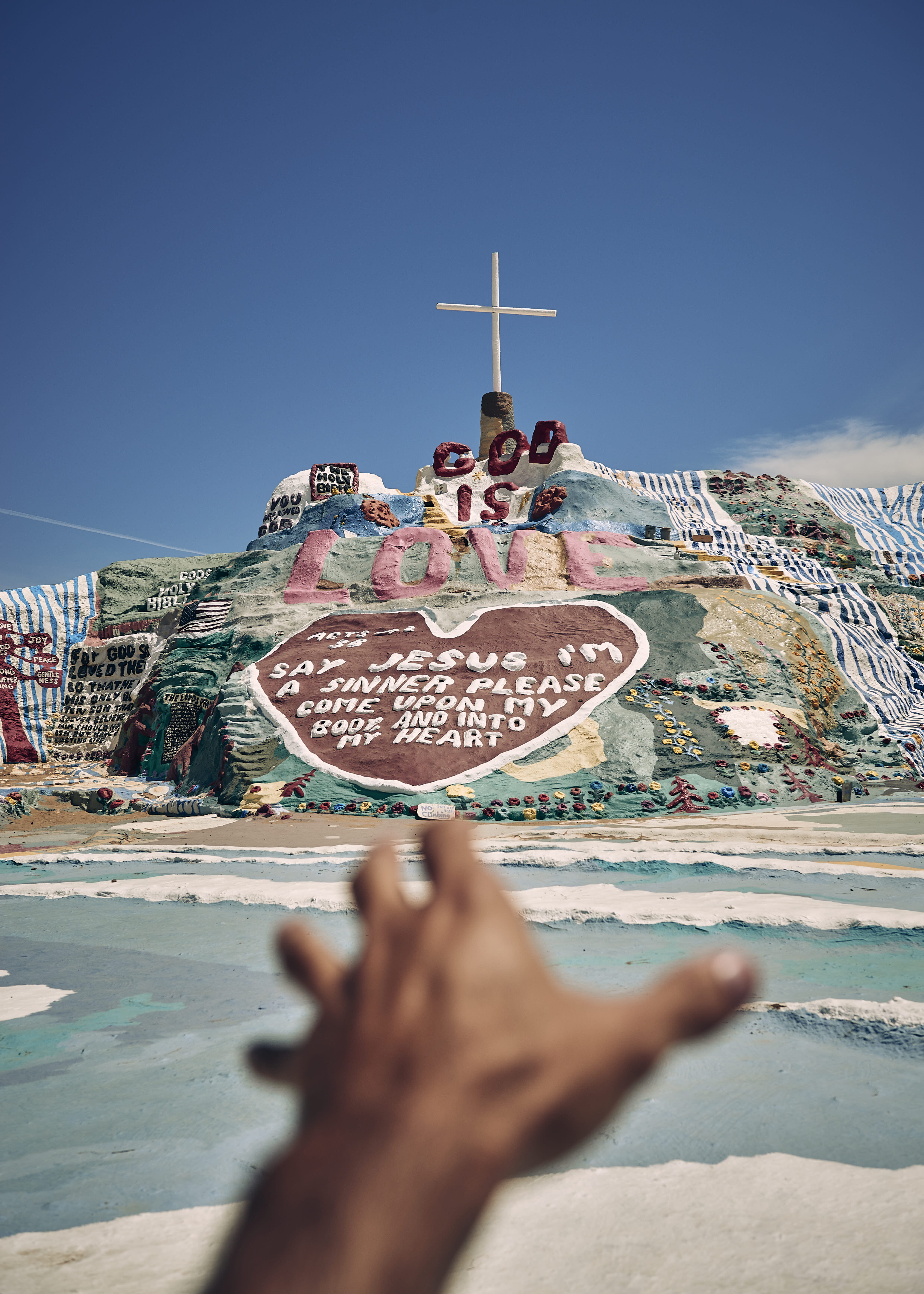 built structure, mountain, jesu, phoyography, reach, lifestyles, figurine, architecture, hand, human body part, day, love, religion, human hand, travel, Phone HD Wallpaper