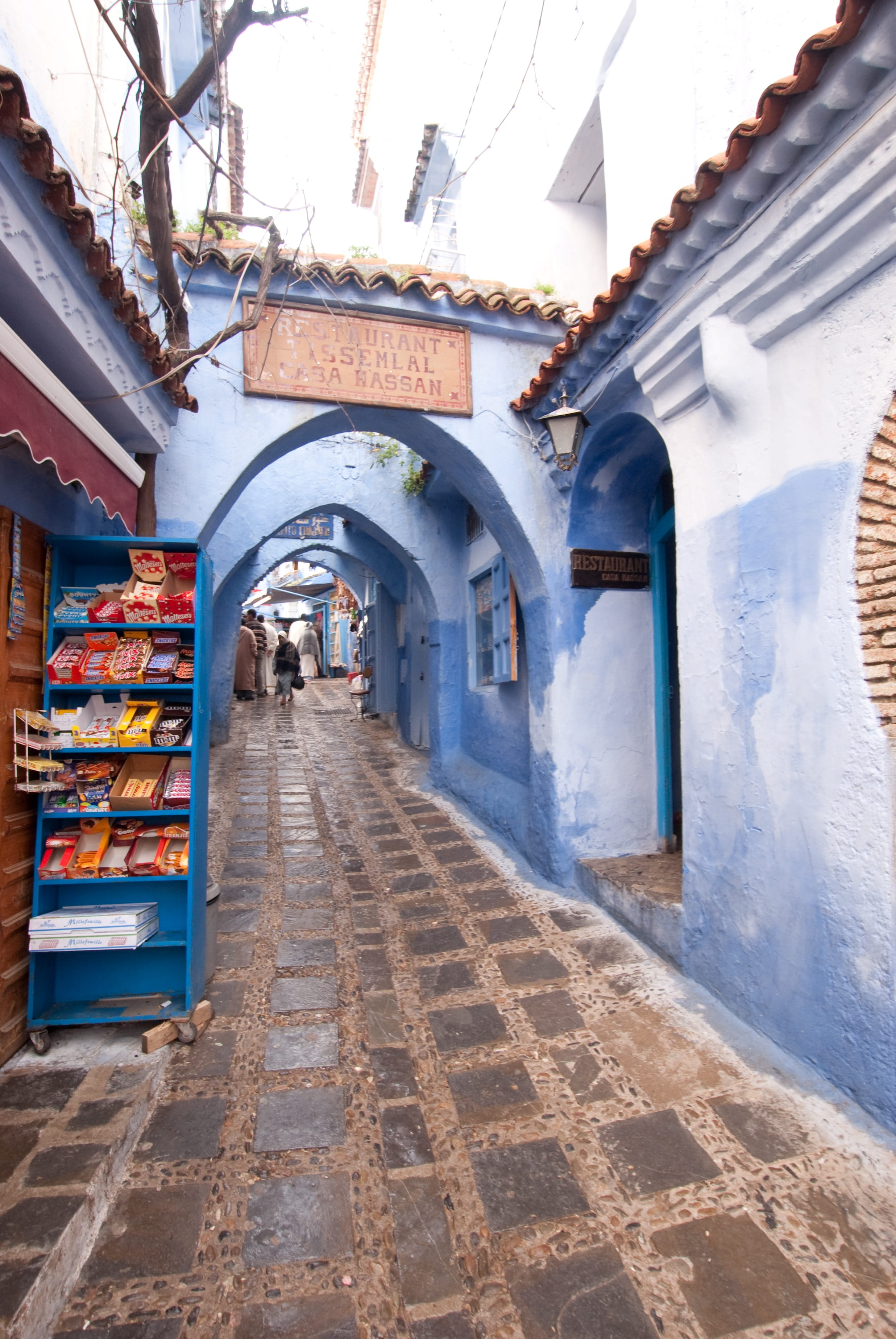 outdoors, building, building exterior, lighting equipment, morocco, people, blue street, nature, the way forward, diminishing perspective, residential district, Phone HD Wallpaper