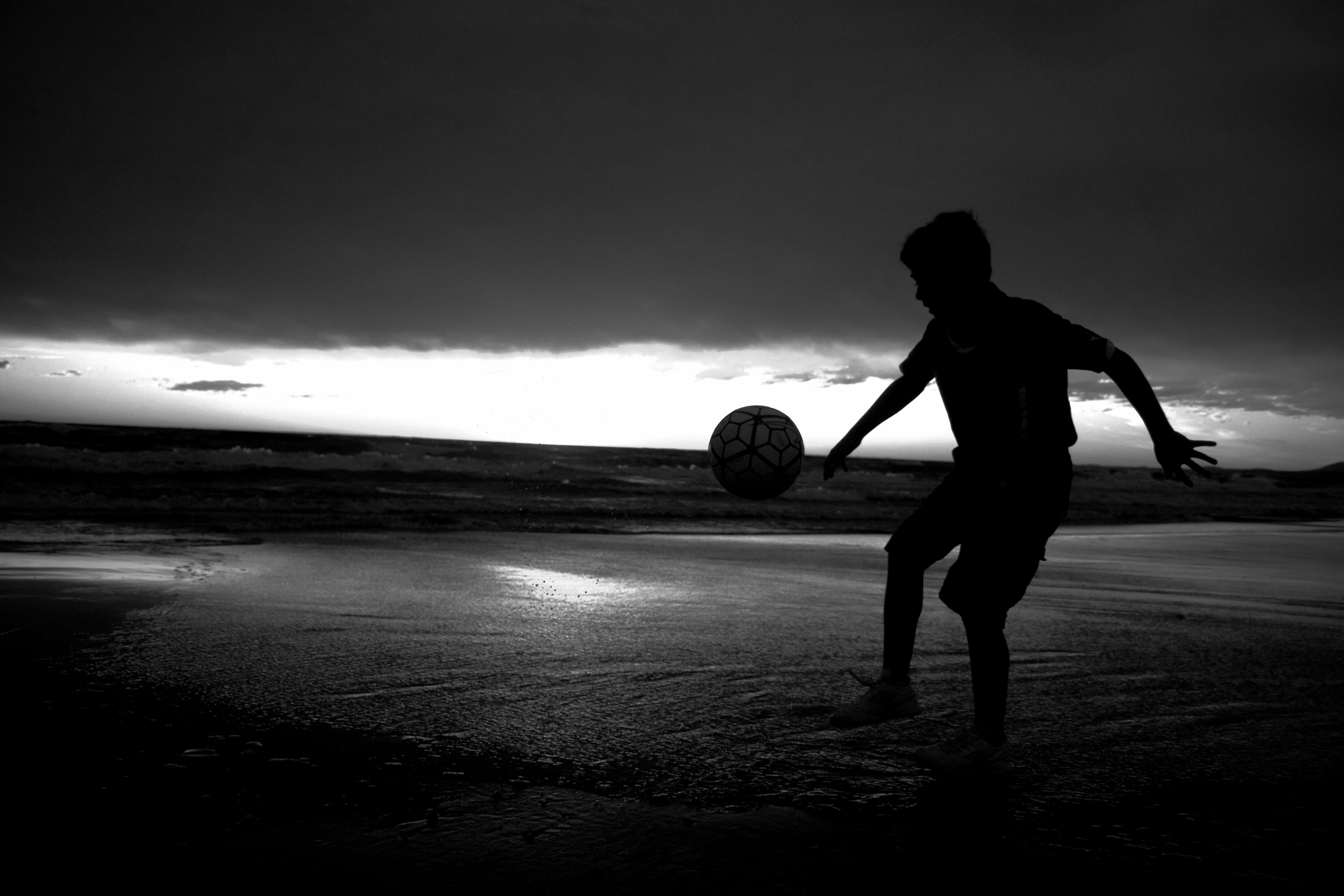 lifestyles, silhouette, water, standing, sky, one person, uruguay, nature, 5K, ball, black and white, sea, full length, land, real people, cloud - sky, HD Wallpaper