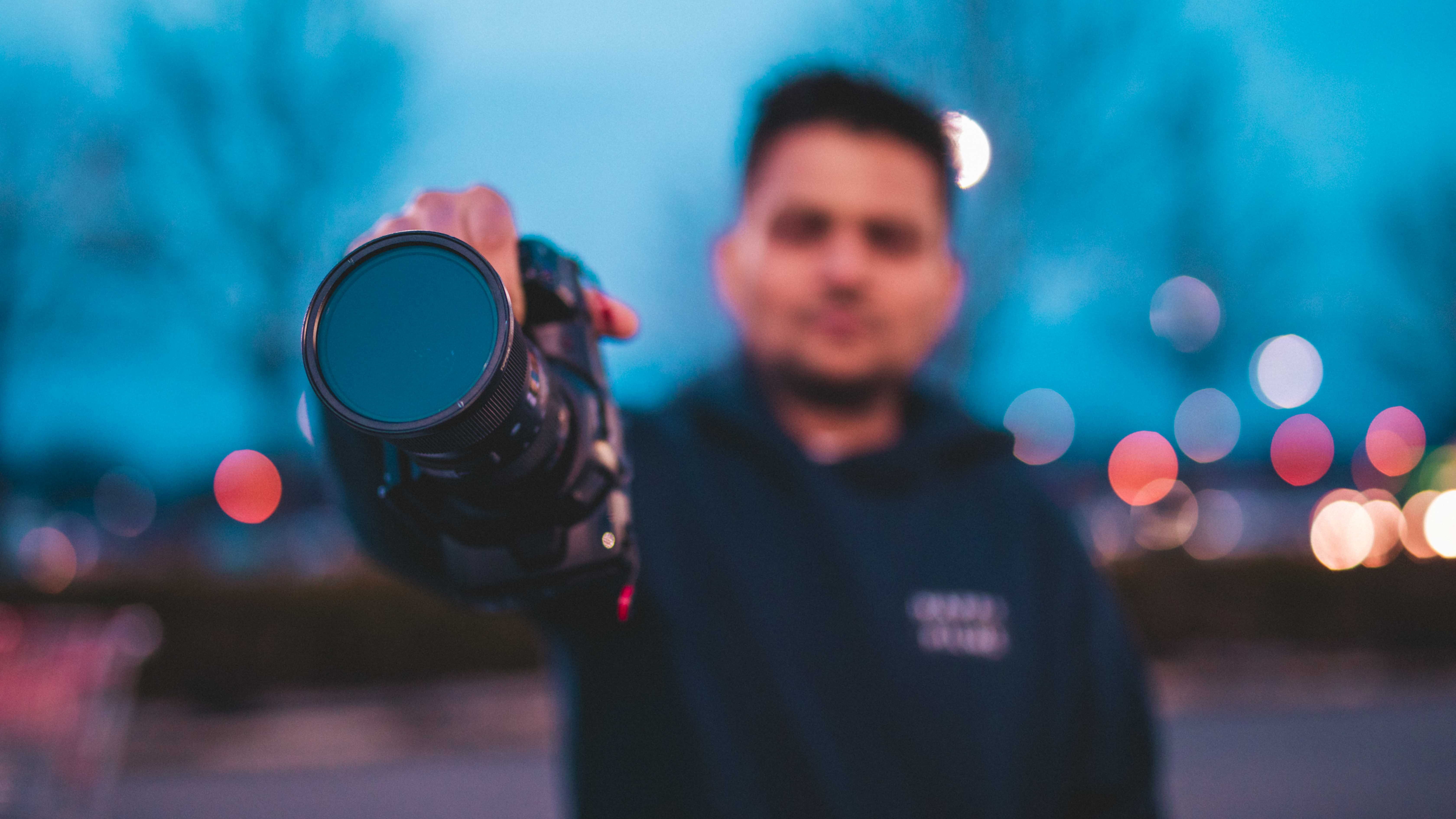 males, bokeh, men, lifestyles, cinematographer, face, illuminated, videographer, leisure activity, focus on foreground, colors, looking at camera, red, HD Wallpaper