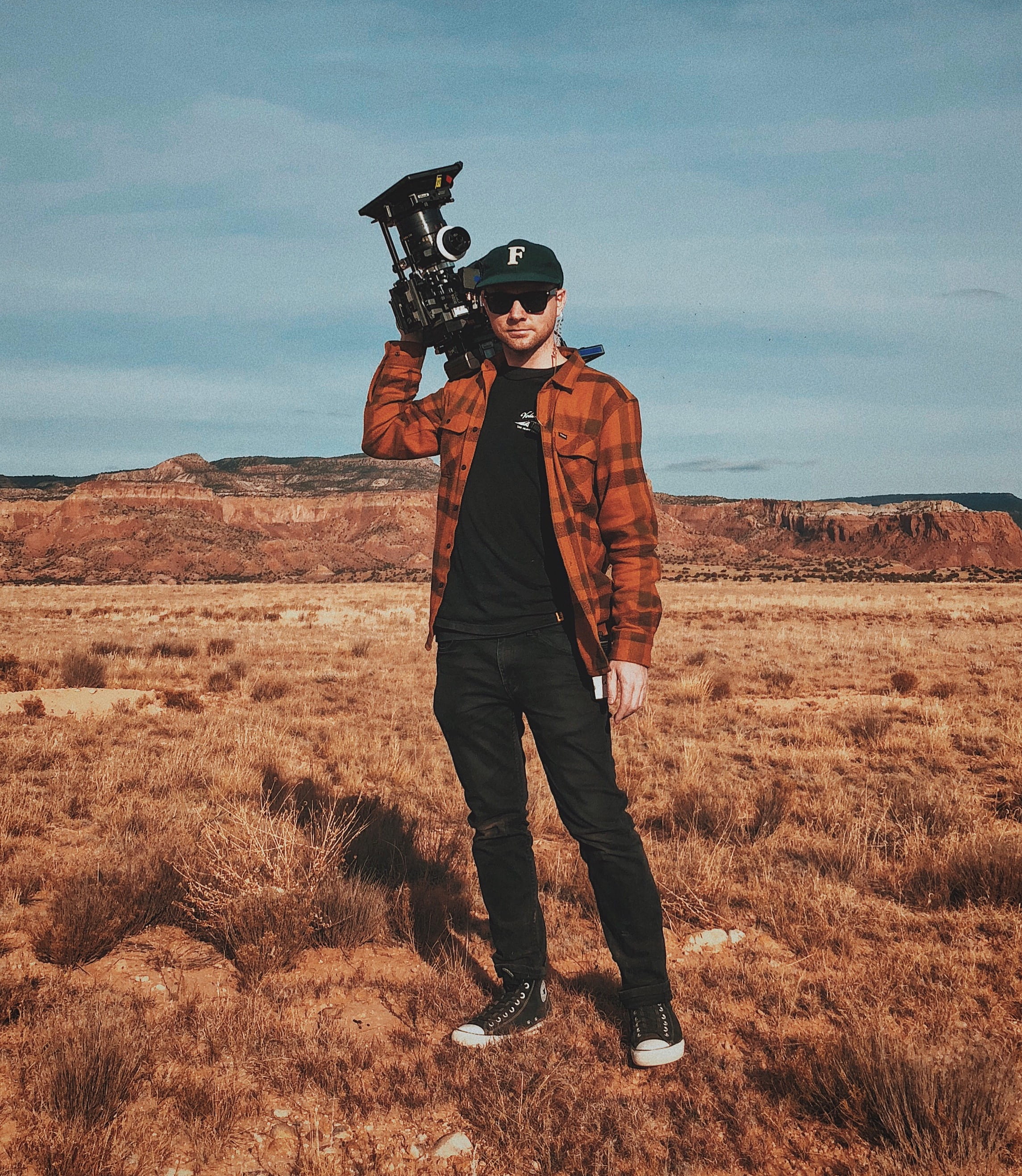 industrial, camcorder, front view, lifestyles, real people, weapon, nature, camera, clothing, black, 2K, carrying, field, man, men, cloud - sky, casual clothing, Phone HD Wallpaper