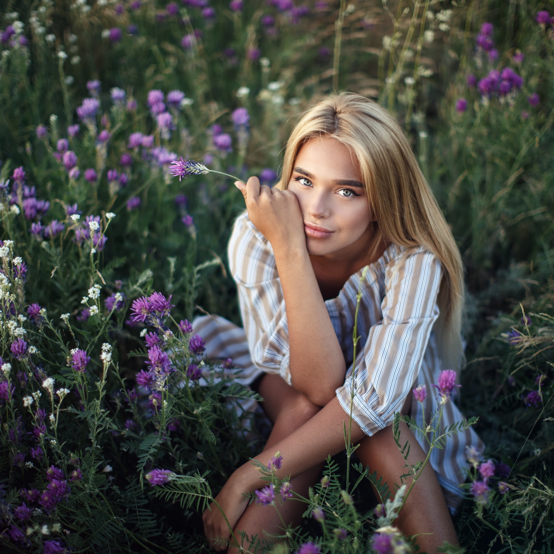 Luba Ivanova, sitting, long hair, face, portrait, Sergey Sorokin, straight hair, mouth, flowers, 1080P, shirt, looking at viewer, blue eyes, model, touching face, Phone HD Wallpaper