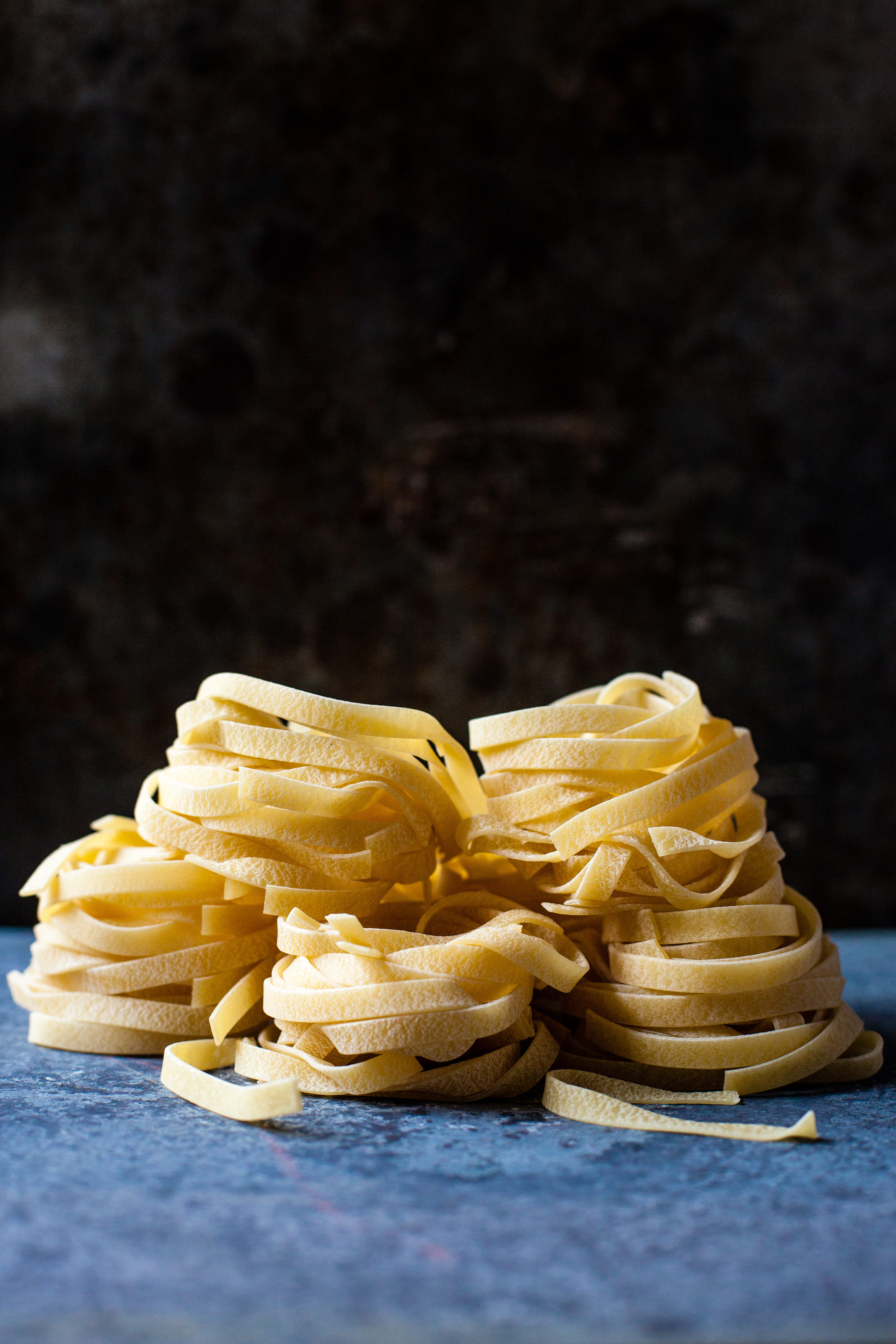 5K, copy space, no people, unhealthy eating, food and drink, black background, snack, uncooked, freshness, indulgence, pastas, stack, studio shot, ready-to-eat, Phone HD Wallpaper