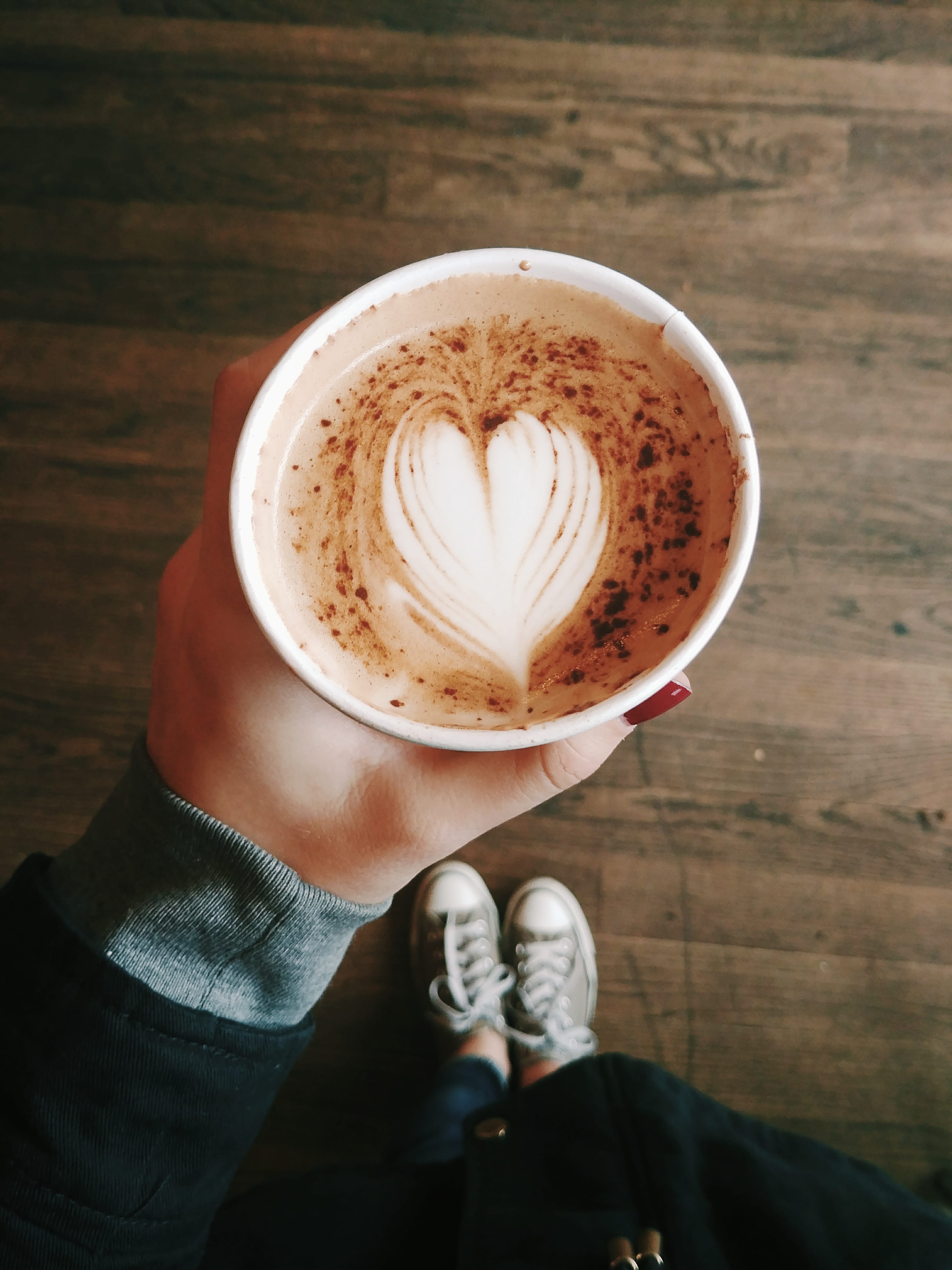 running shoe, shoe, hot drink, sneaker, beverage, refreshment, freshness, footwear, frothy drink, holding, finger, human body part, human, personal perspective, Phone HD Wallpaper