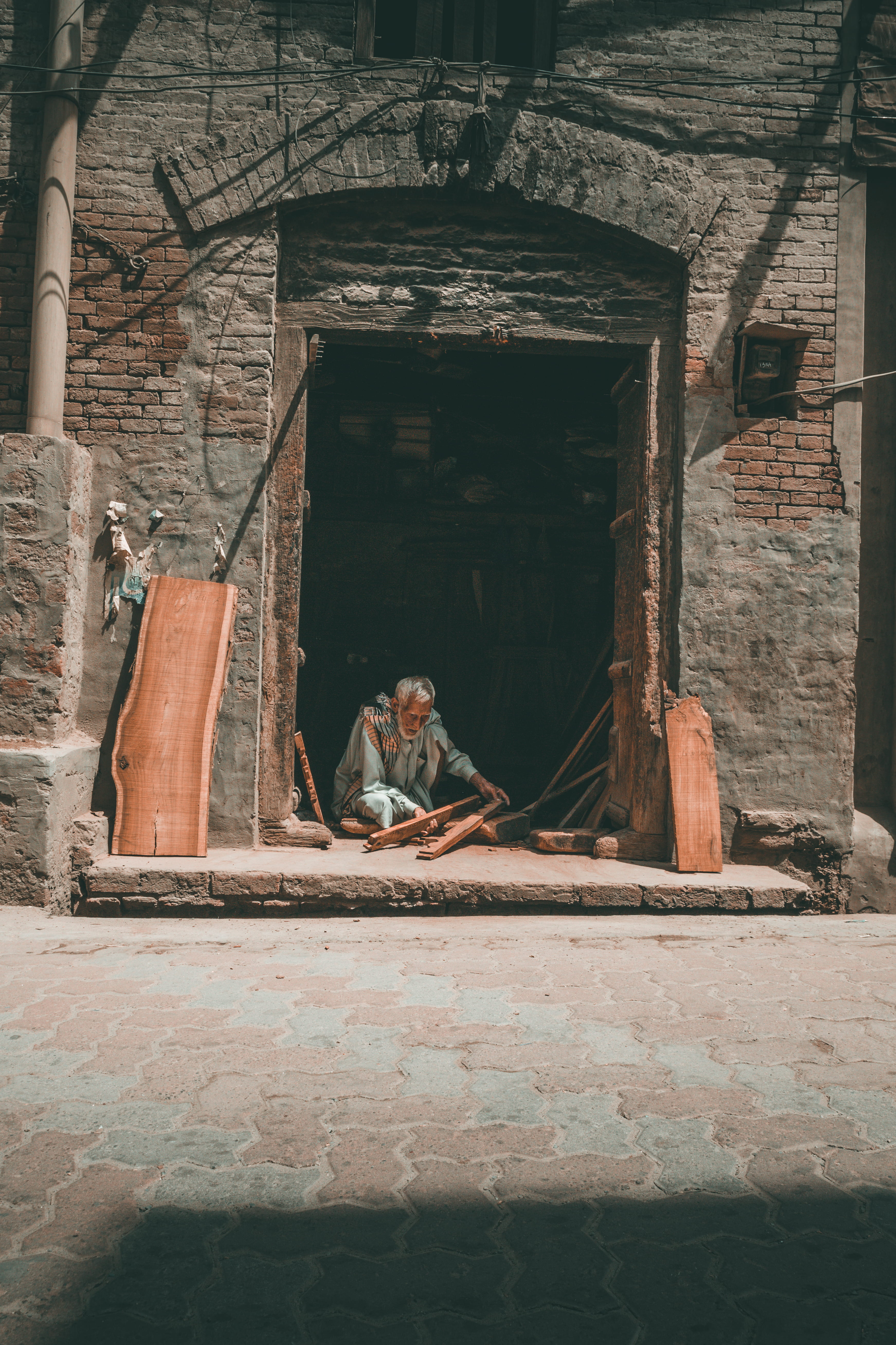 building, lumber, old, stone wall, building exterior, real people, wall, woodwork, brick, beard, portrait, workman, outdoor, brick wall, pakistan, wood, Phone HD Wallpaper