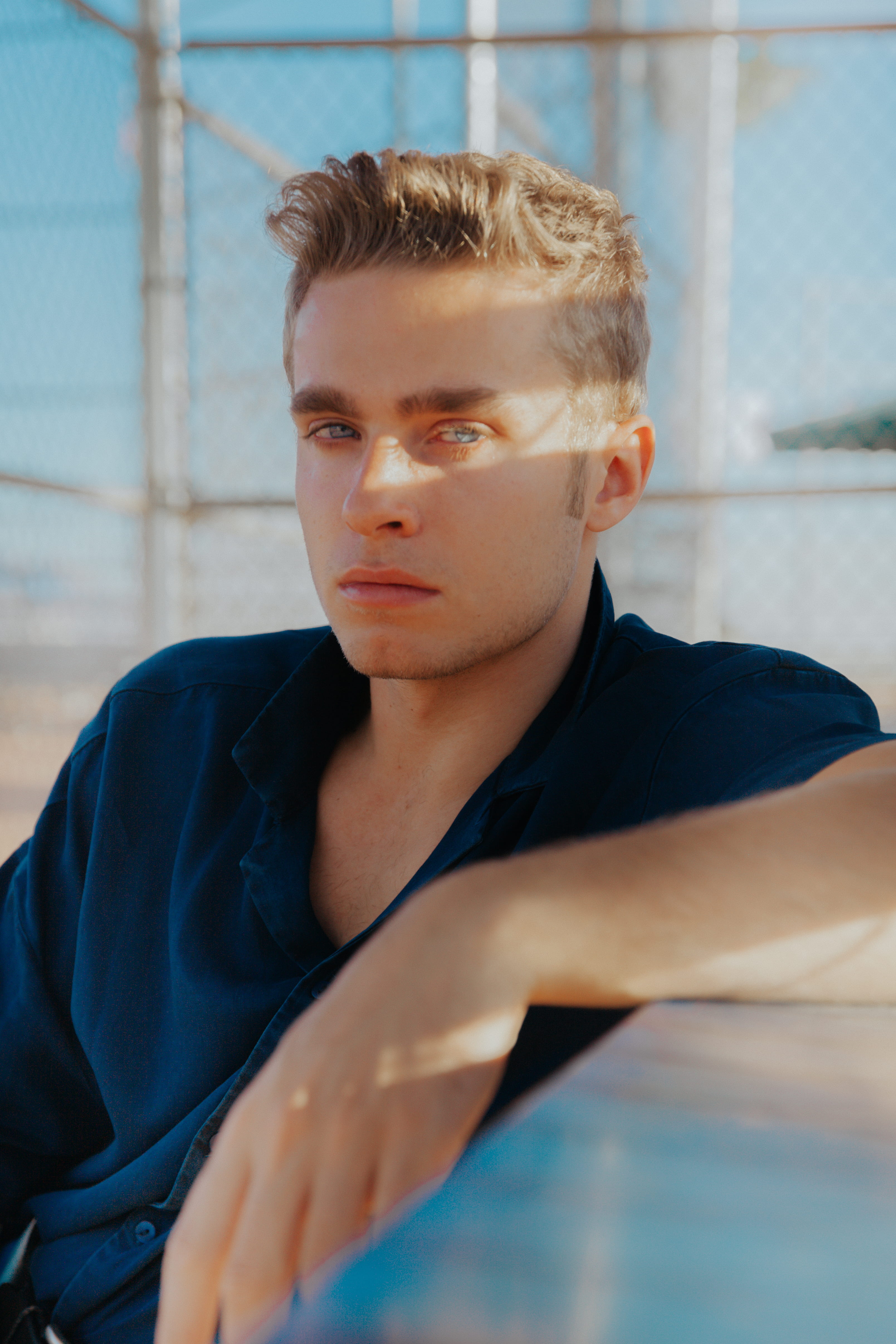 focus on foreground, blue, contemplation, fashion, photoshoot, portrait, looking at camera, charming, boy, real people, male, lifestyles, teenage boys, Phone HD Wallpaper