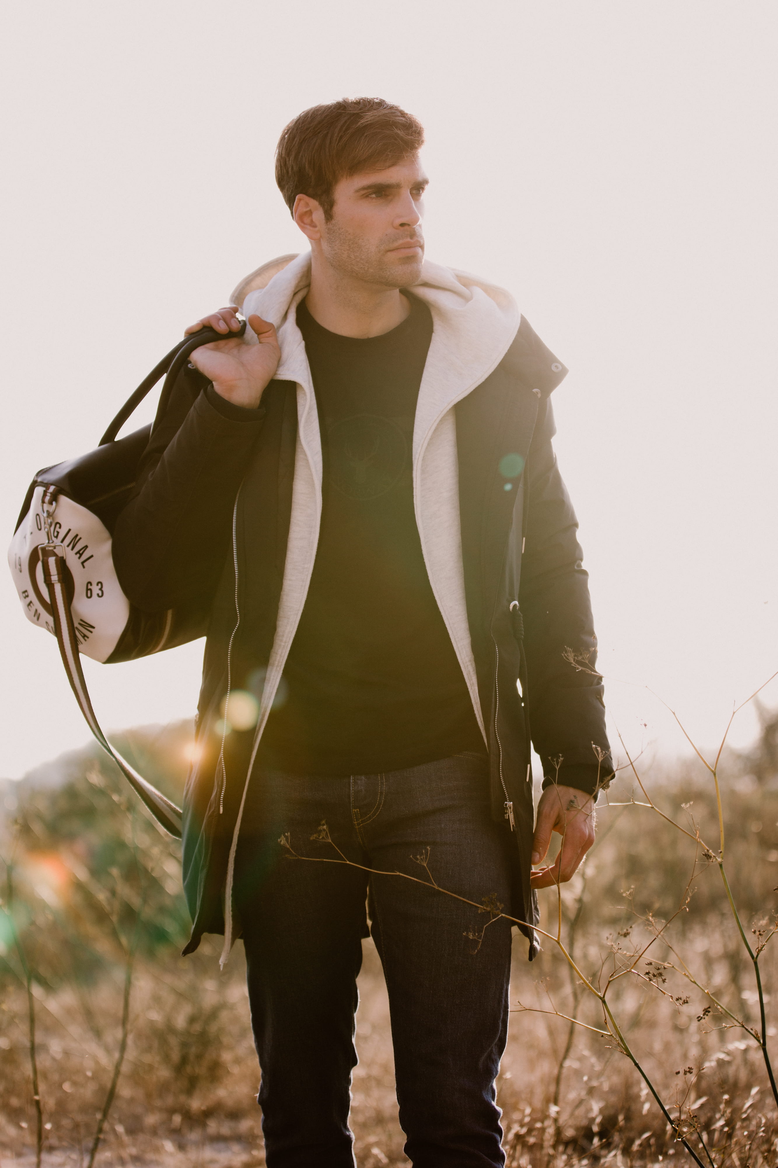 three quarter length, real people, handsome, clothing, duffel, person, land, sky, field, nature, standing, man, lifestyles, portrait, outdoor, one person, Phone HD Wallpaper