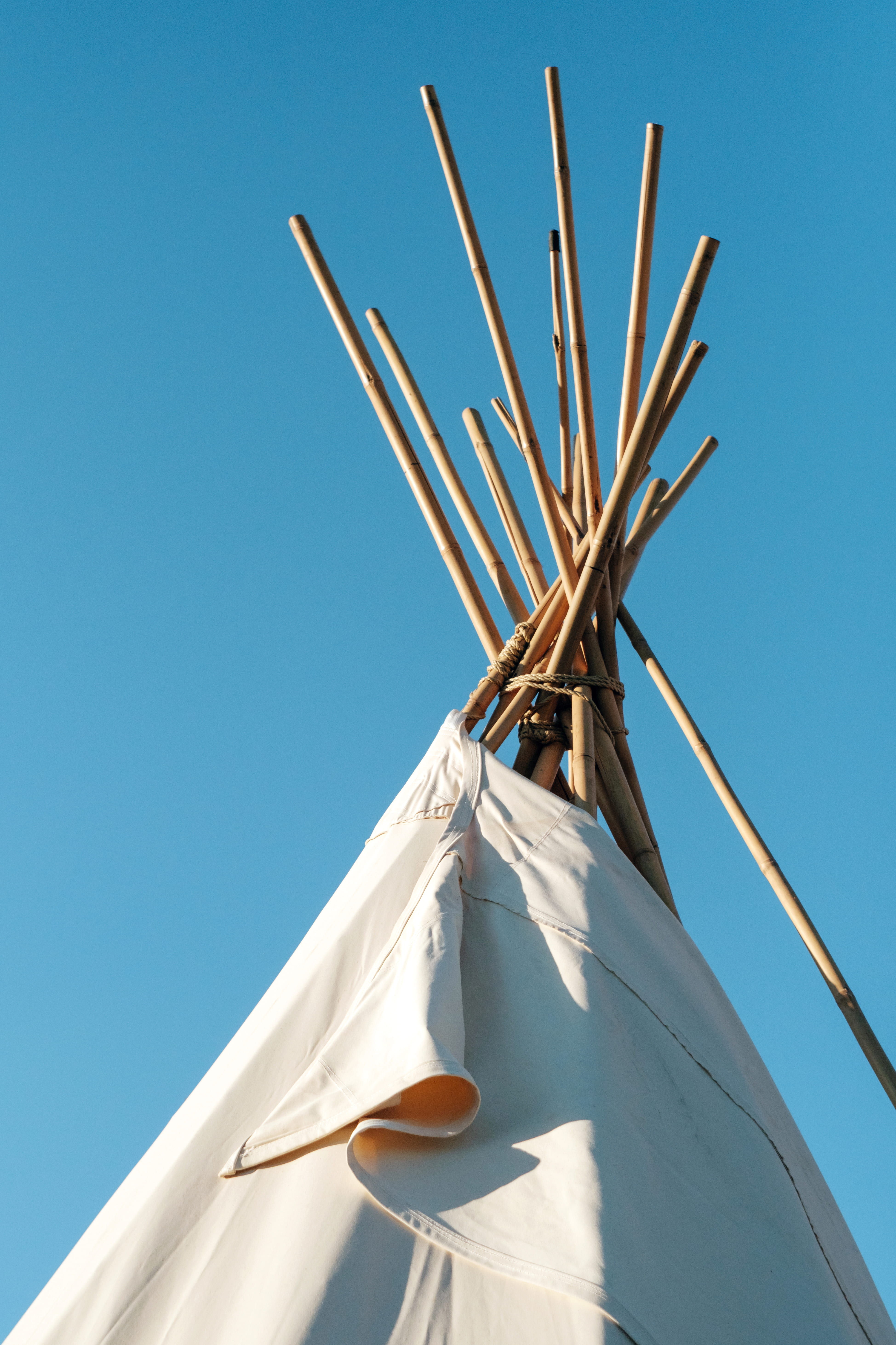 built structure, outdoor, textile, teepee, building, low, blue sky, blue, sunlight, blue and white, 5K, clear sky, angle, wilderness, white, outdoors, Phone HD Wallpaper