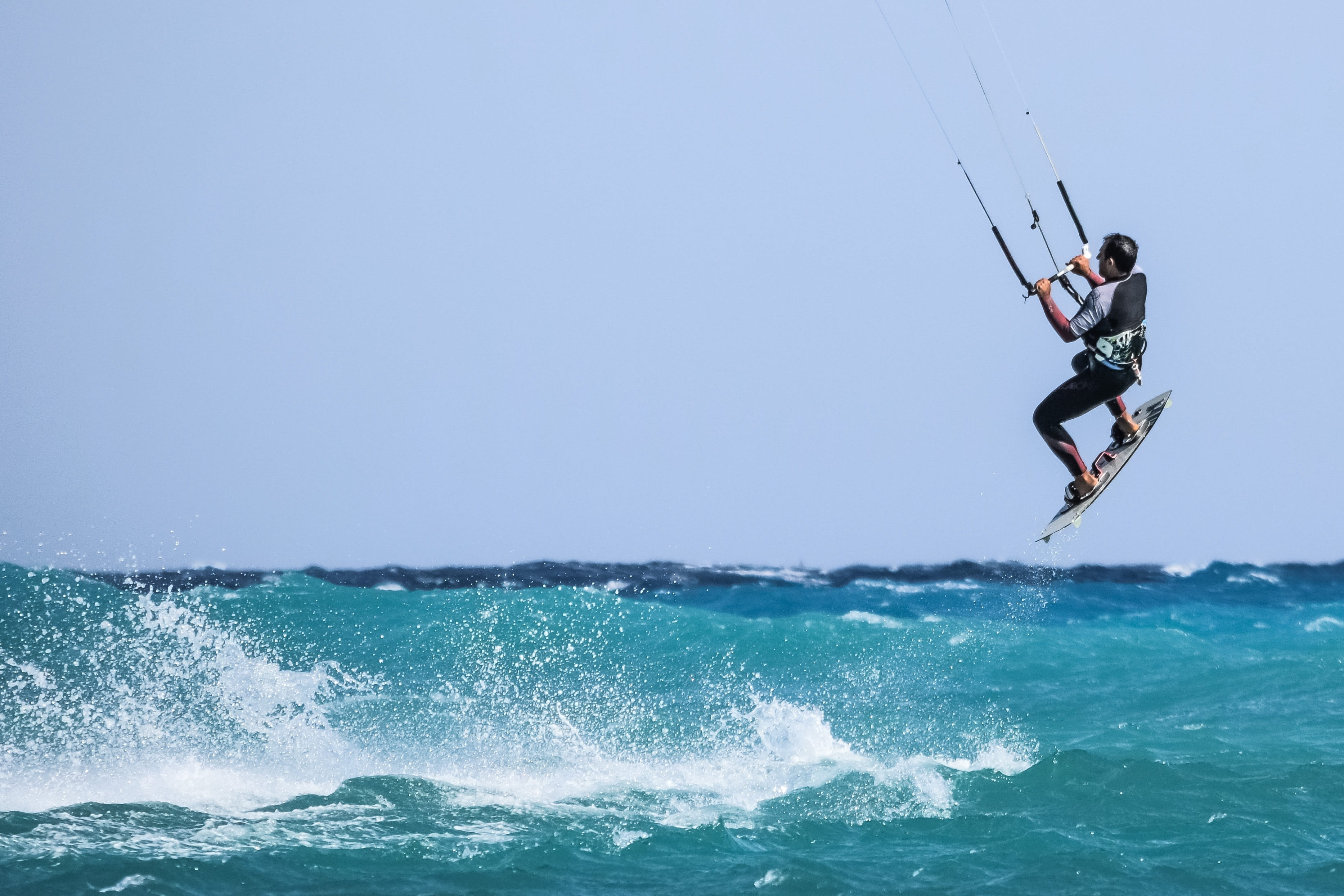 copy space, leisure activity, jump, men, flight, flying, 2K, clear sky, day, nature, wave, one person, activity, dom, extreme, high, outdoors, horizon over water, HD Wallpaper