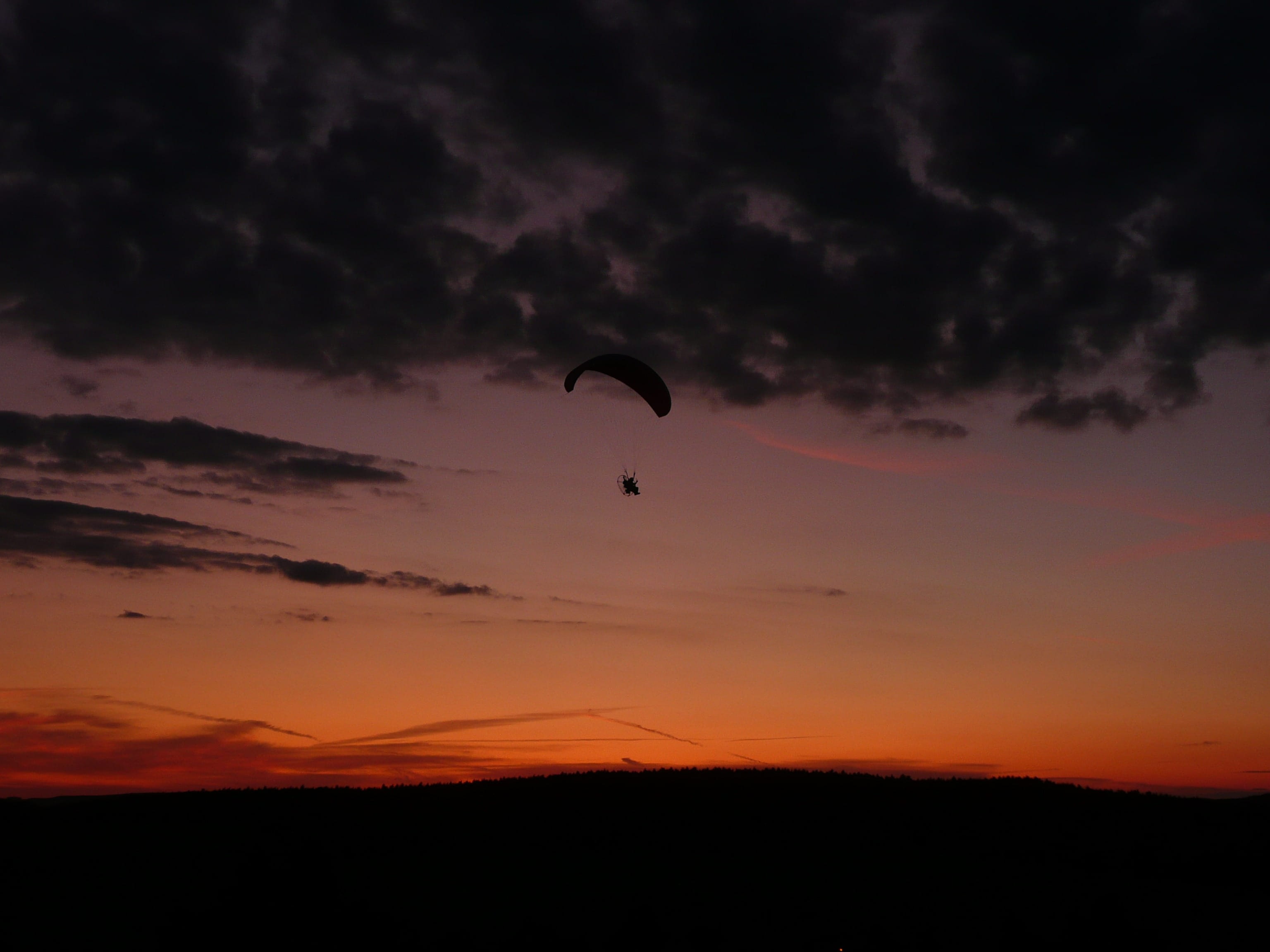 silhouette, dramatic sky, tranquility, activity, mid-air, Flying, adrenaline, sky, sunset, scenics, tranquil scene, orange color, scenics - nature, extreme sports, HD Wallpaper