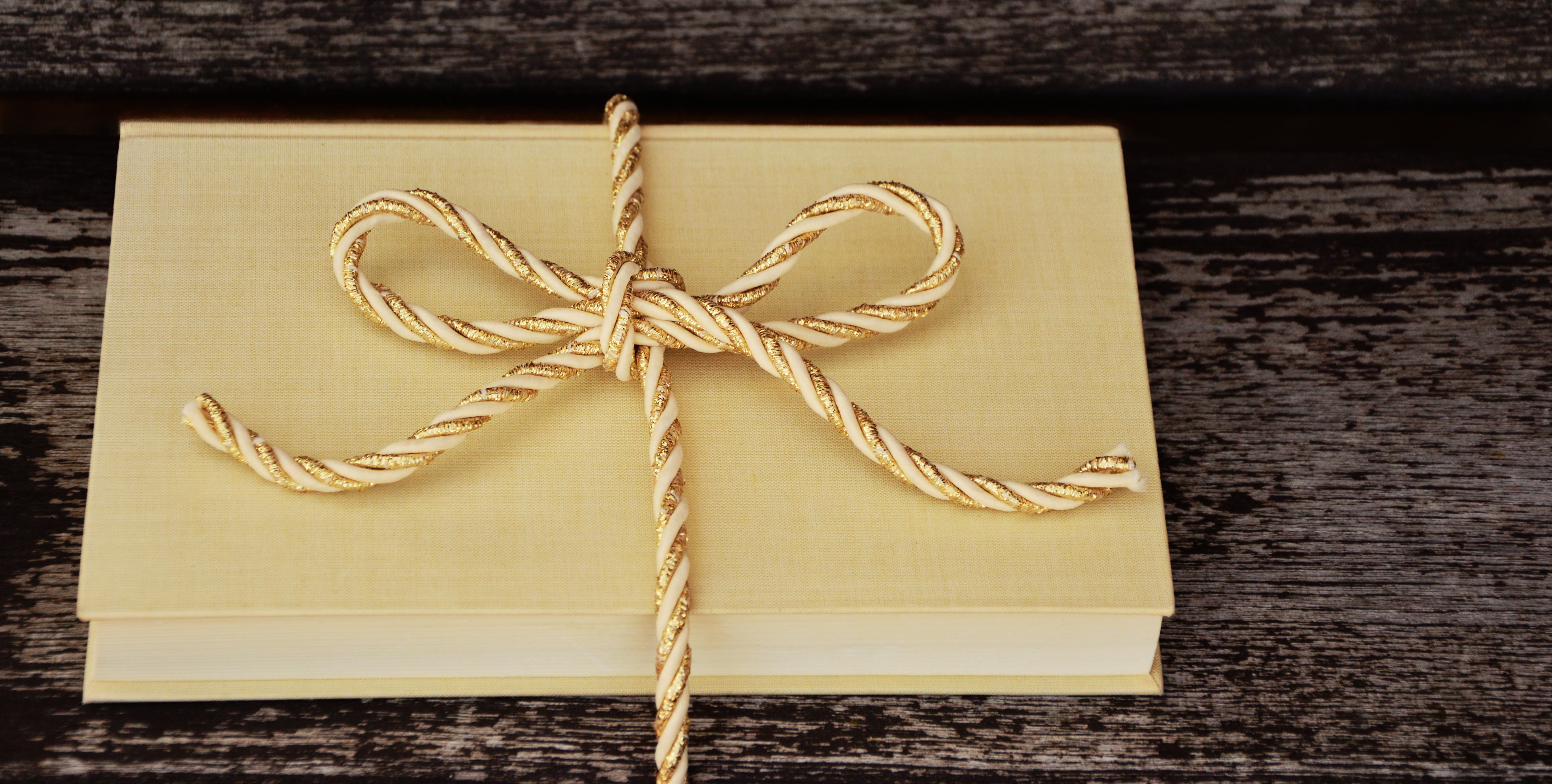 gift packaging, packaging, celebration, paper, golden, tied bow, christmas gift, packed, wood - material, bow, studio shot, 5K, pack, day, directly above, HD Wallpaper