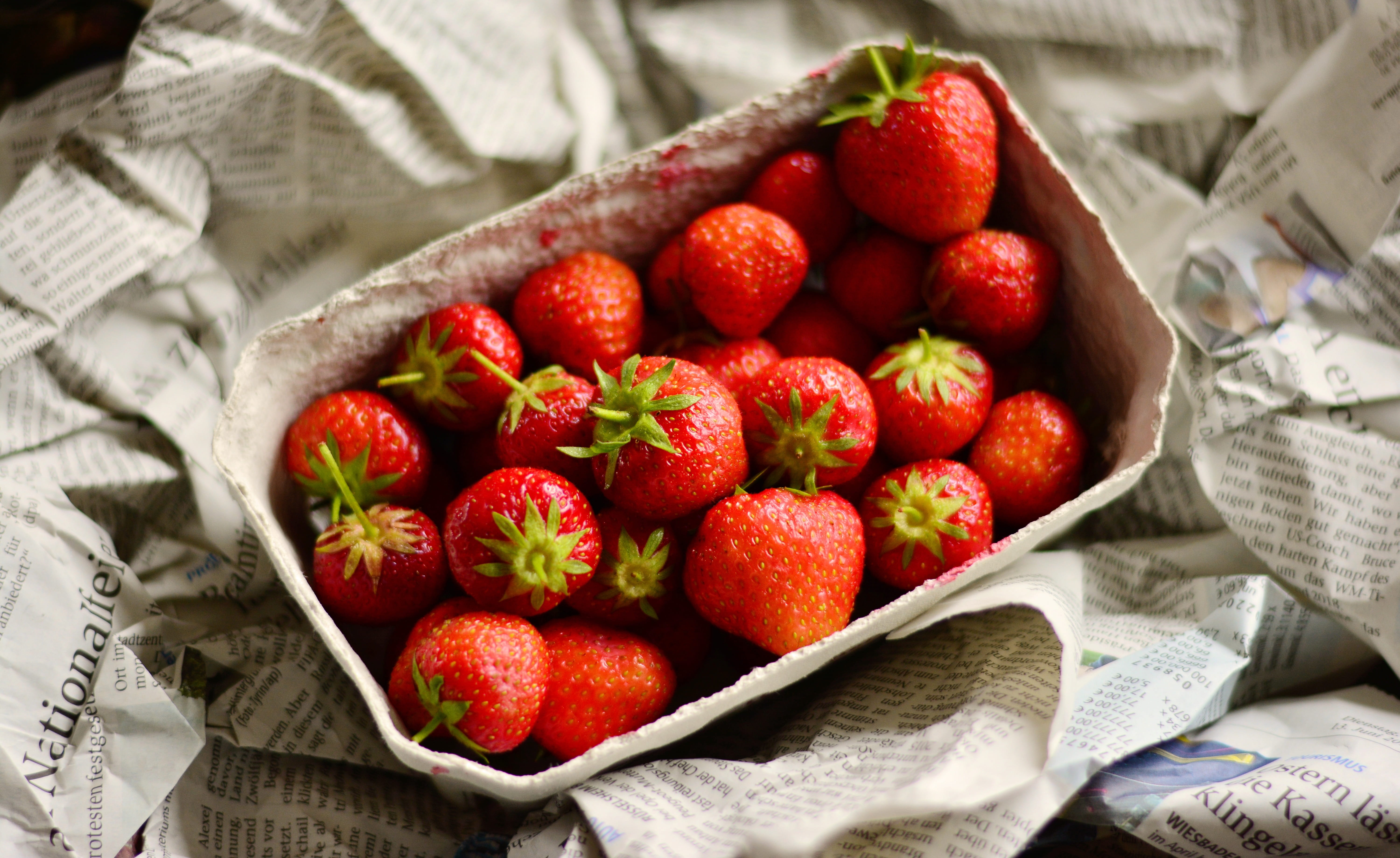 red, strawberry fruit, freshness, no people, berry fruit, healthy eating, container, eat, market, close-up, high angle view, fruits, food and drink, newspaper, HD Wallpaper