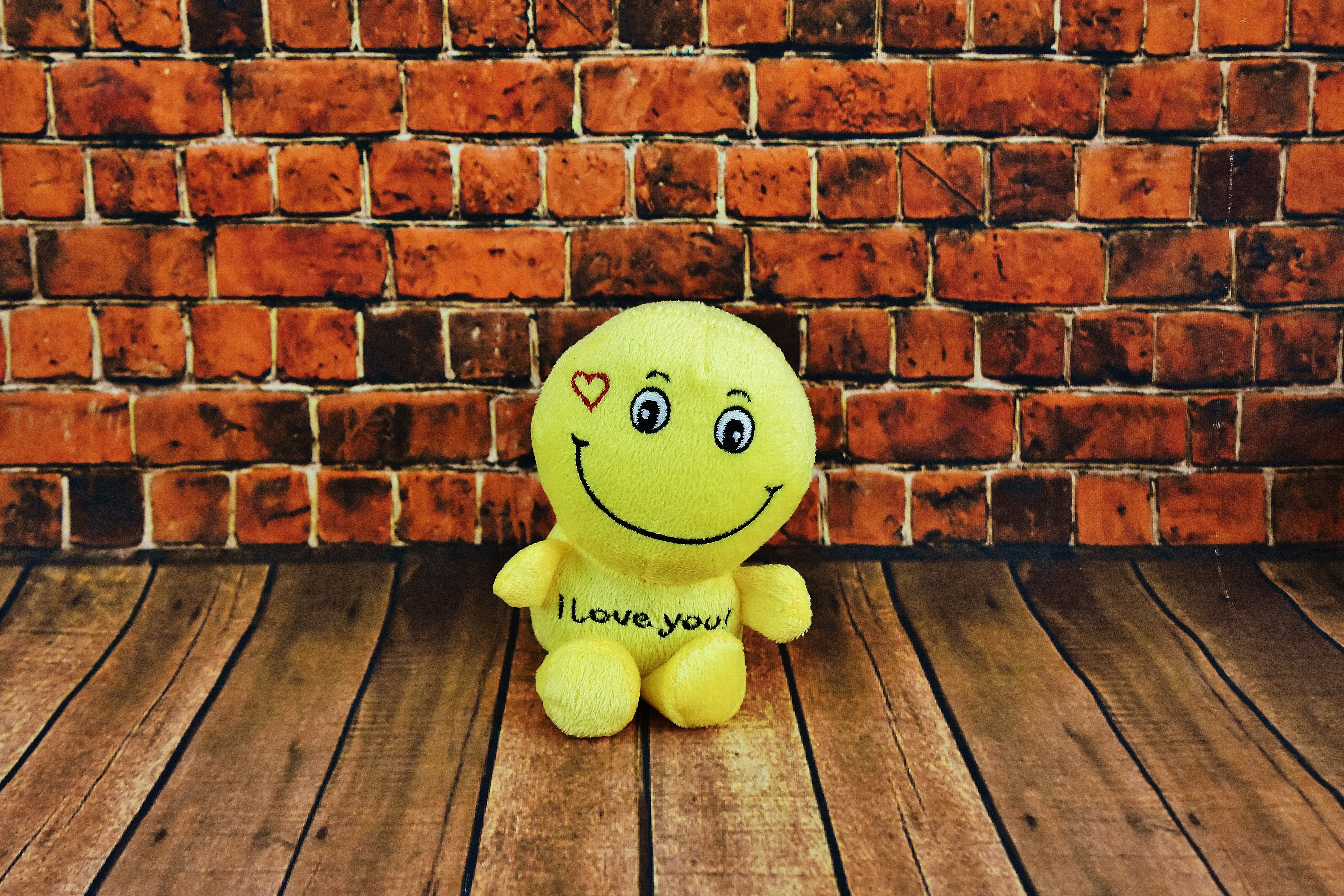 soft toy, fun, yellow, face, purry, children, soft, brick, table, wood - material, still life, lion, toys, brick wall, hardwood floor, wall, wall - building feature, HD Wallpaper