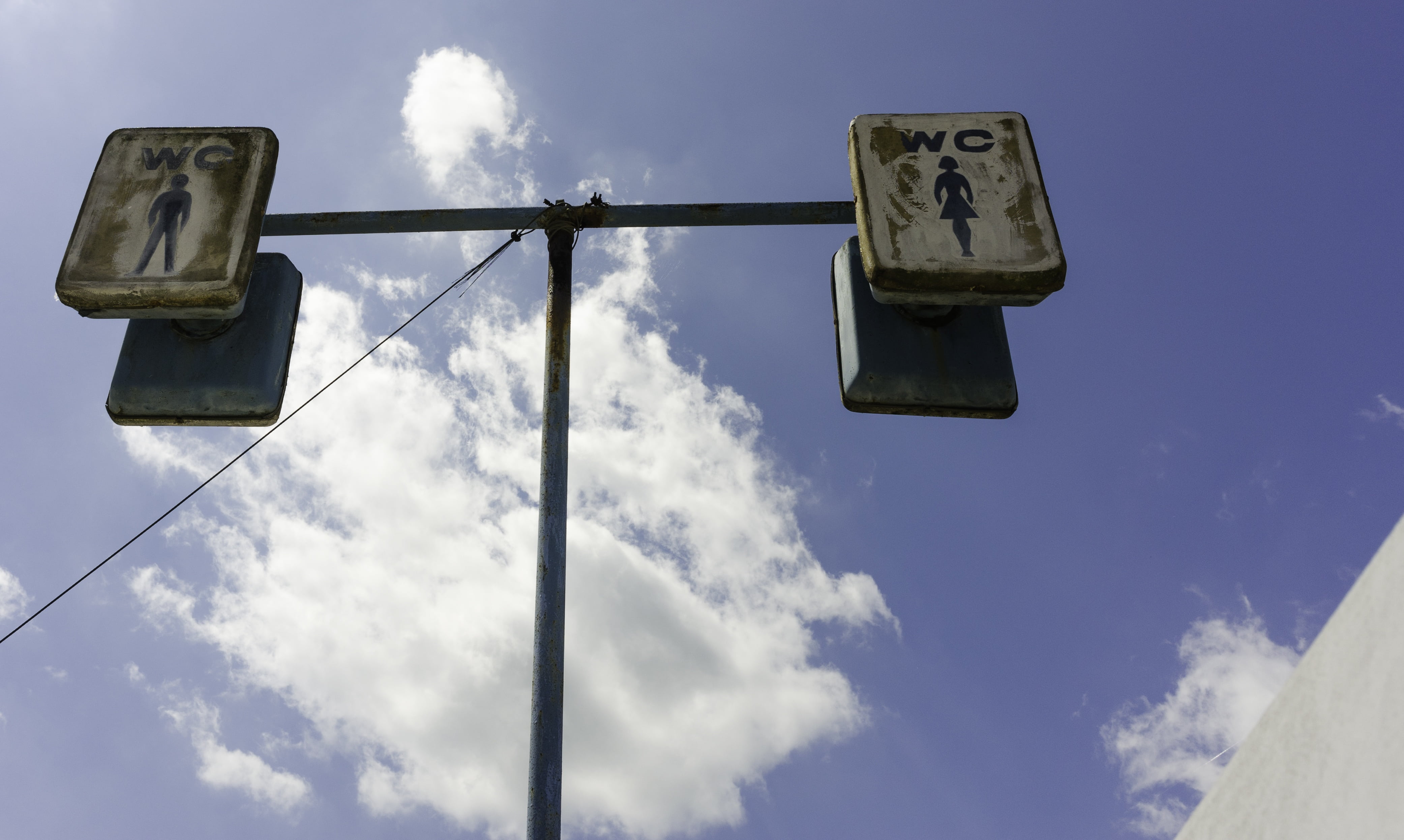 wc, lighting equipment, sign, sky, pole, low angle view, public, street, blue, no people, road sign, directly below, clouds, day, street light, cloud - sky, HD Wallpaper