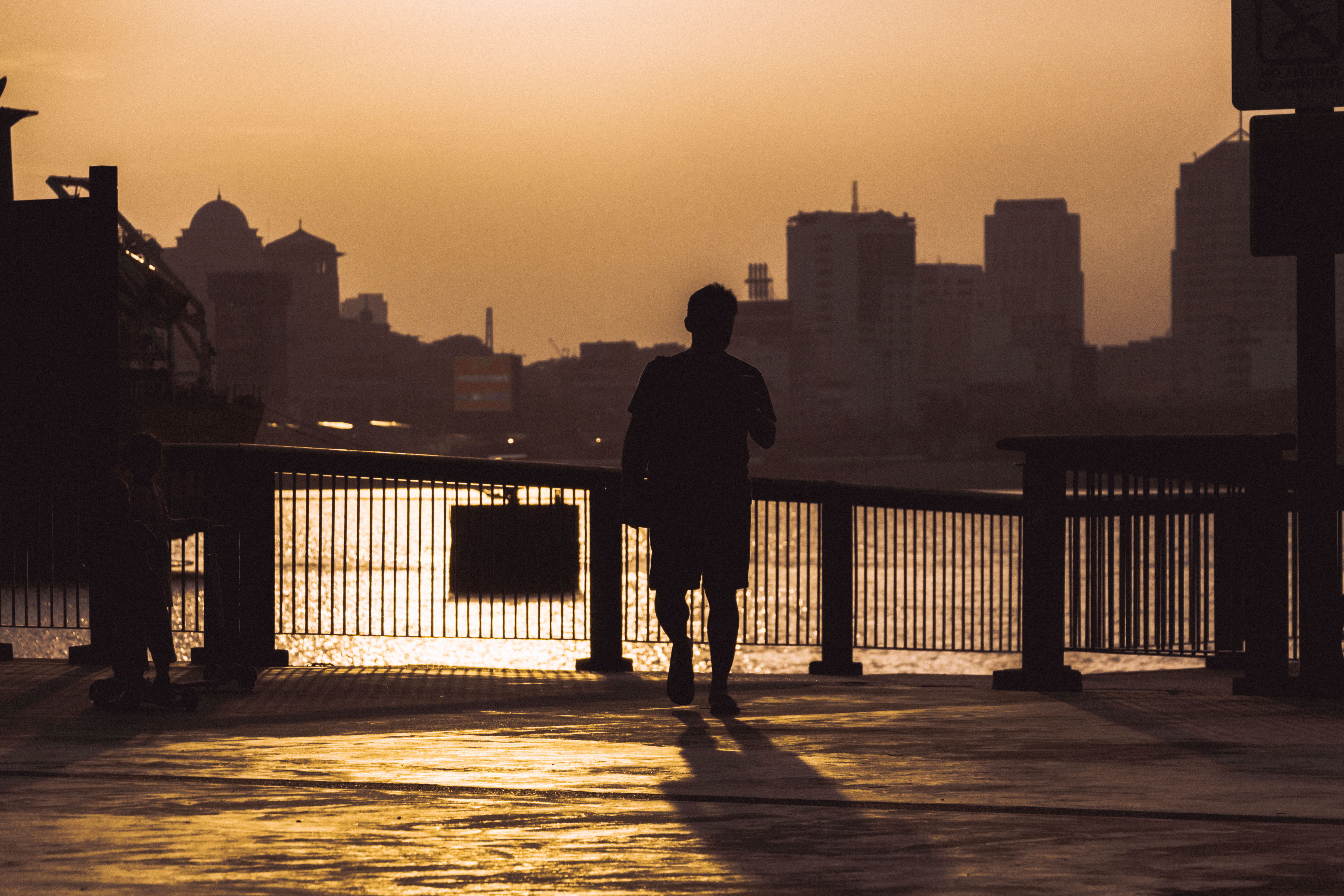 full length, silhouette, city, men, railing, one person, sky, office building exterior, streetphotography, skyscraper, cityscape, sunset, architecture, HD Wallpaper