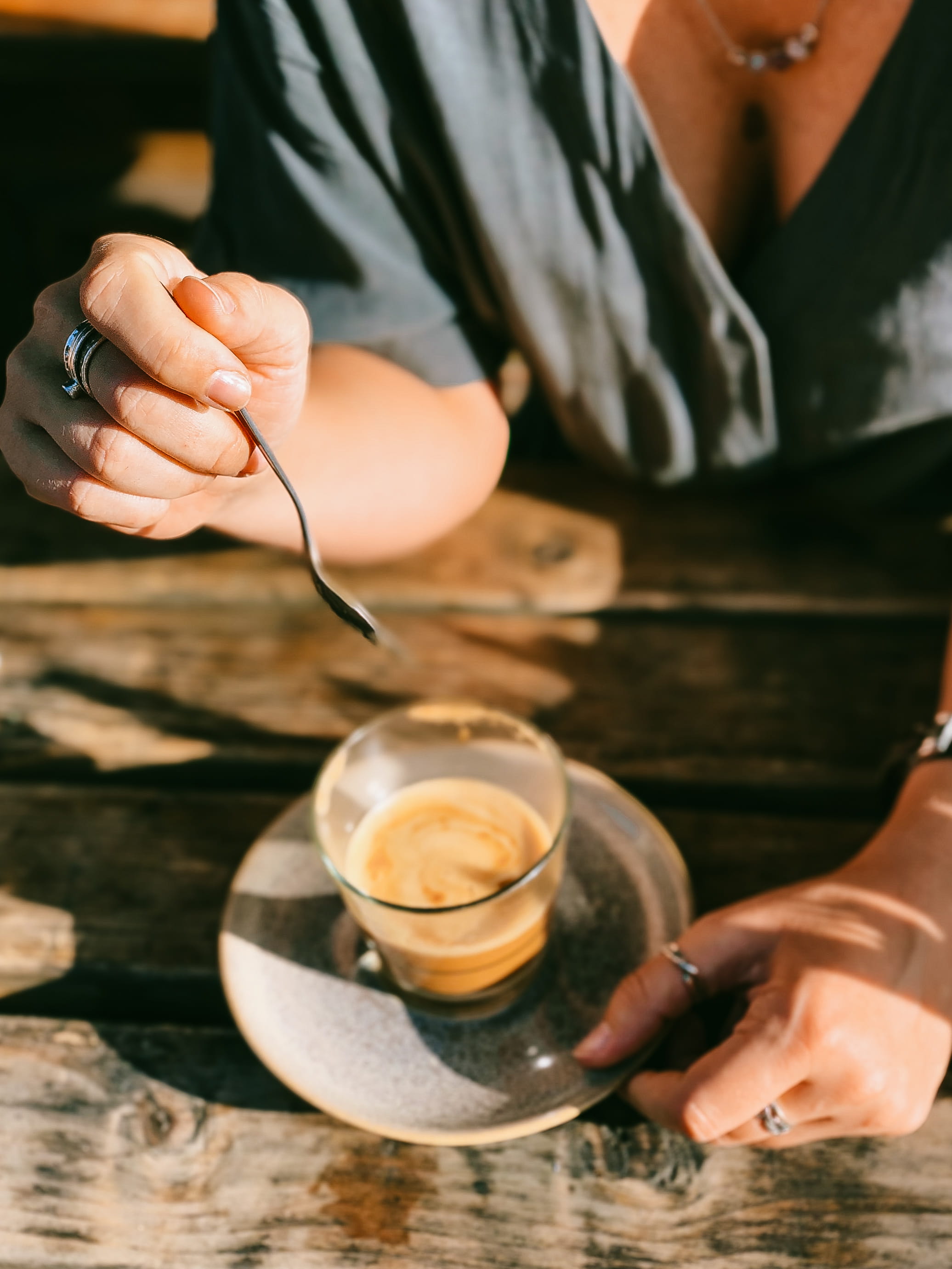 indoors, real people, food, mug, refreshment, daylight, teaspoon, stir, drink, coffee, holding, liquid, brown, wooden, human body part, close-up, preparing food, Phone HD Wallpaper