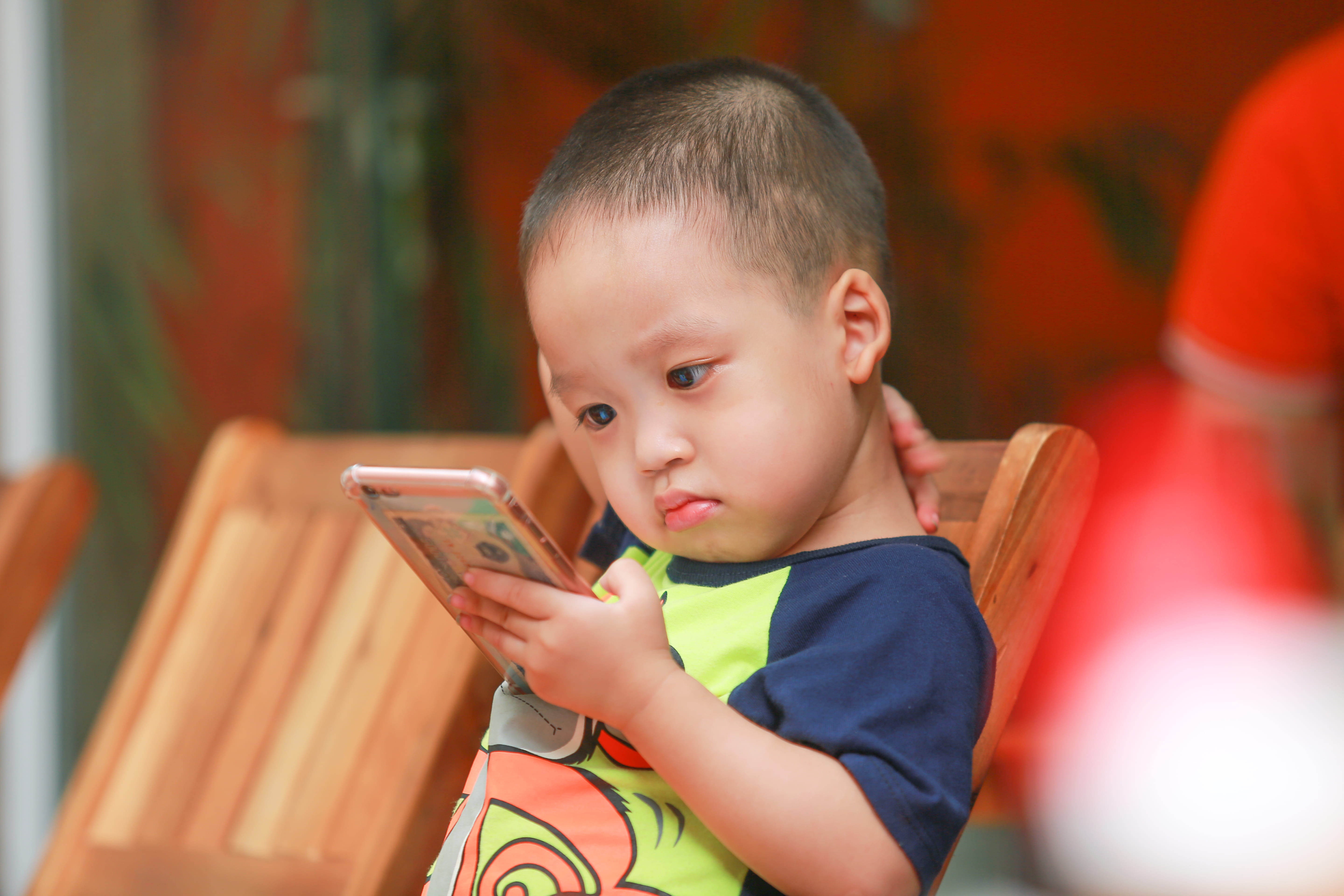 real people, one person, focus on foreground, offspring, chair, close-up, person, headshot, childhood, casual clothing, cellphone, indoors, males, boy, HD Wallpaper