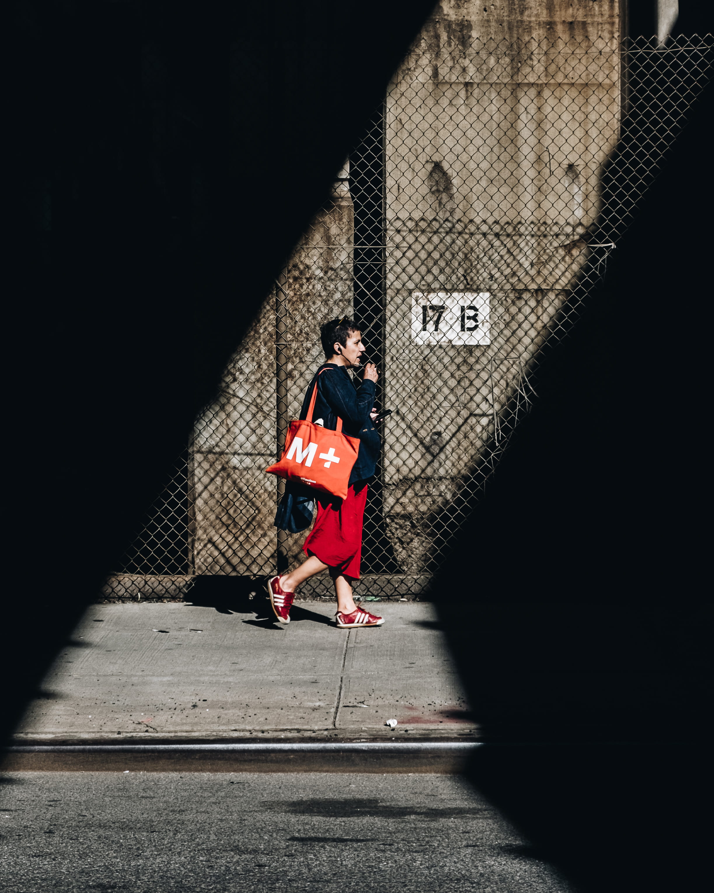 adult, sunlight, human, person, security, architecture, new york, clothing, shoe, outdoors, 2K, brooklyn, red, footwear, city, carrying, coat, wall - building feature, Phone HD Wallpaper