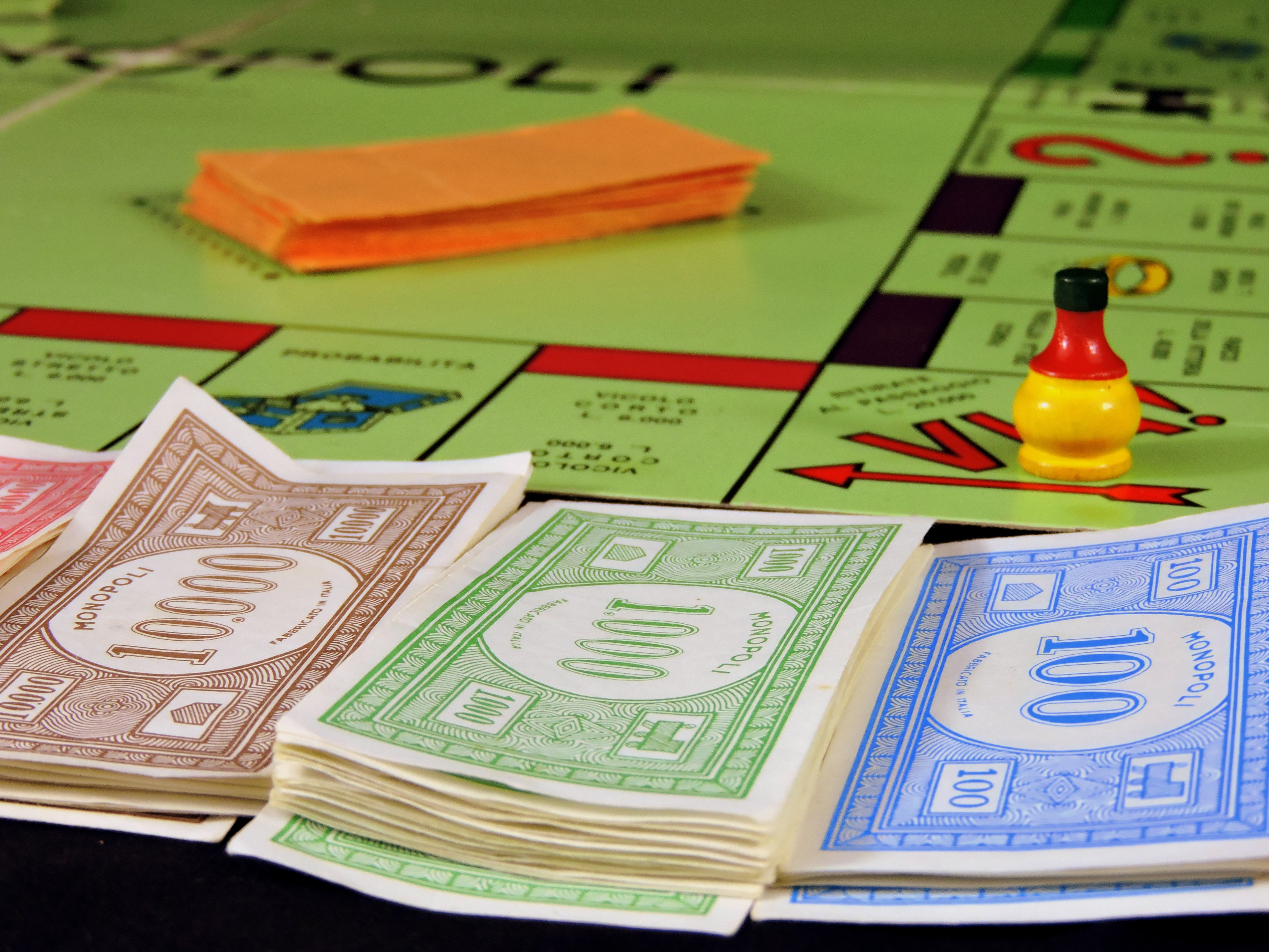 paper currency, business, male likeness, board, indoors, unexpected, wealth, monopoly, departure, play, paper, representation, table, high angle view, no people, HD Wallpaper
