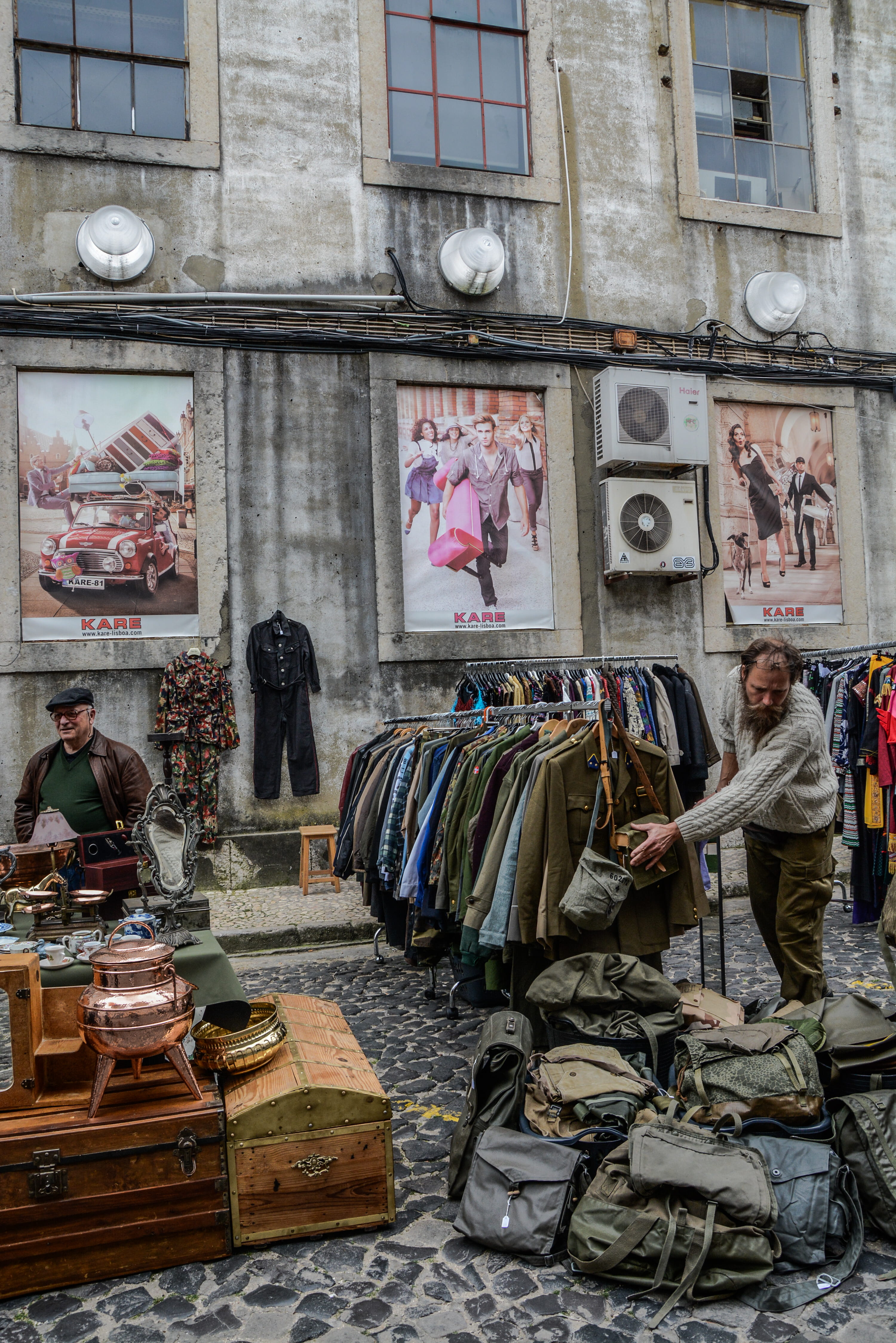 city, real people, person, bags, army surplus, building exterior, day, outdoors, beside, street, road, shirt, clothes, street market, garage sale, flea market, Phone HD Wallpaper