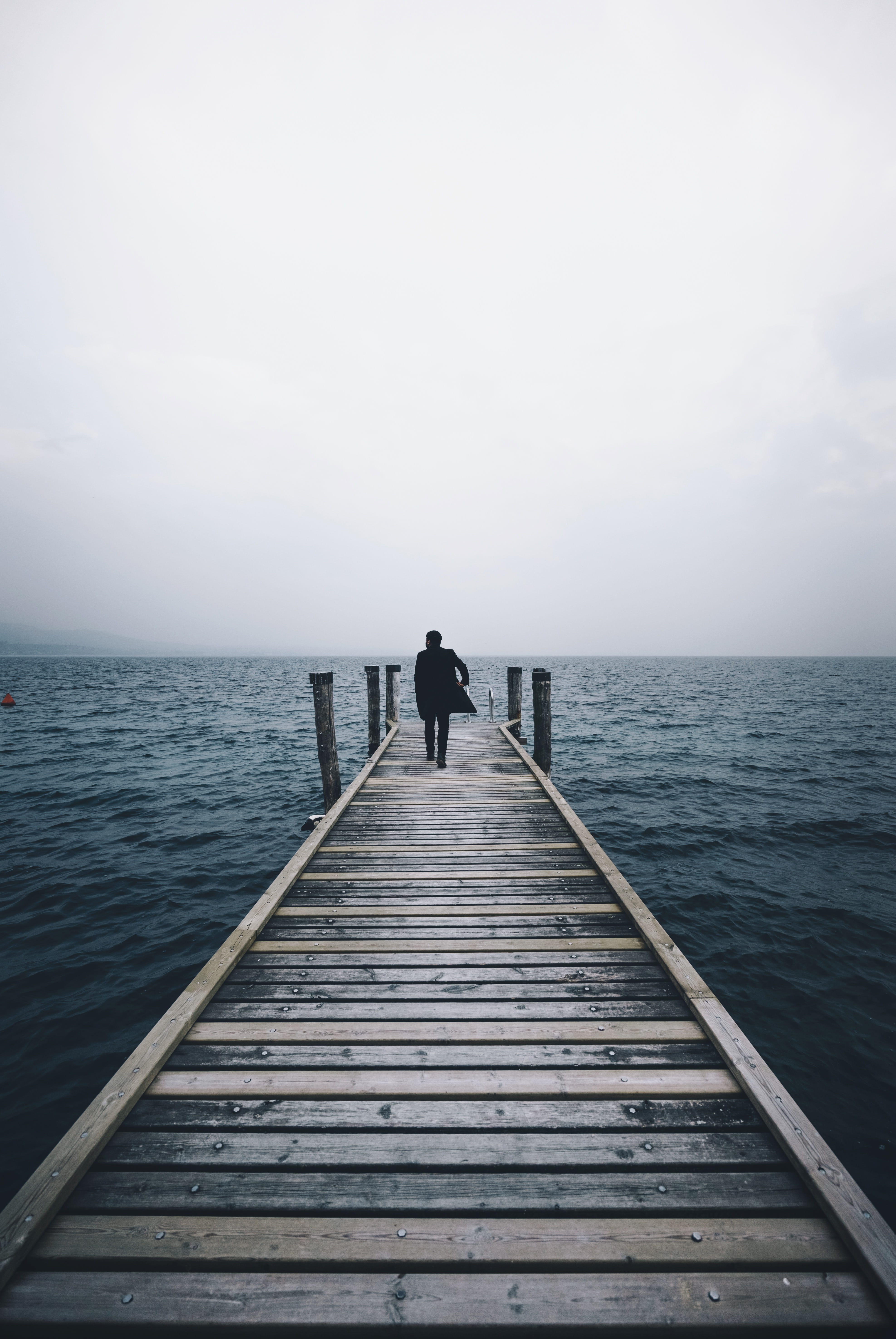 real people, lake, horizon over water, one Person, water, sea, suit, ocean, middle, daytime, solitude, tranquil Scene, walking, jetty, port dock, pier, Phone HD Wallpaper