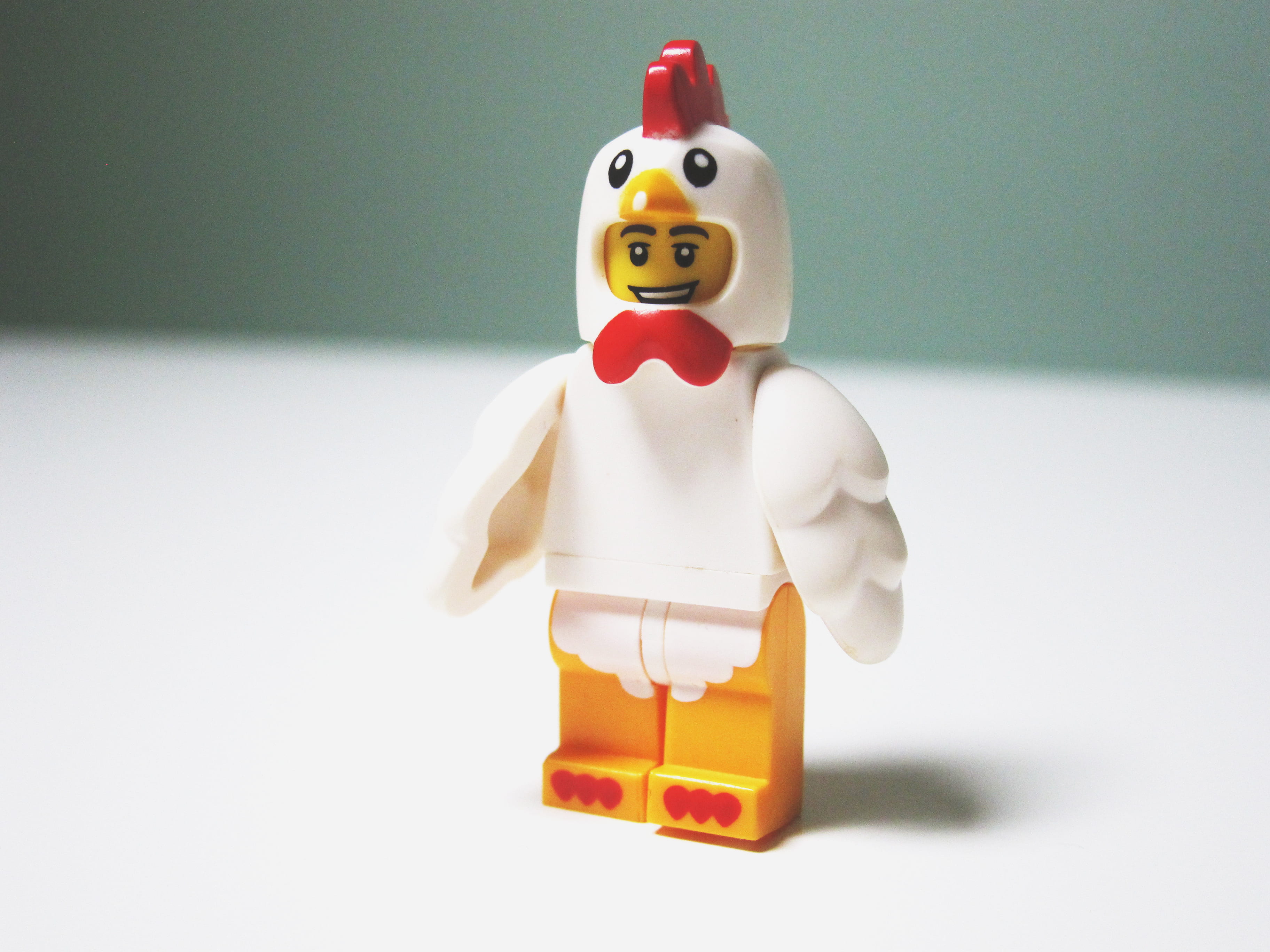 indoors, male likeness, figure, figurine, 2K, studio shot, chicken suit, table, humor, creativity, shallow, chicken, lego, no people, human representation, HD Wallpaper