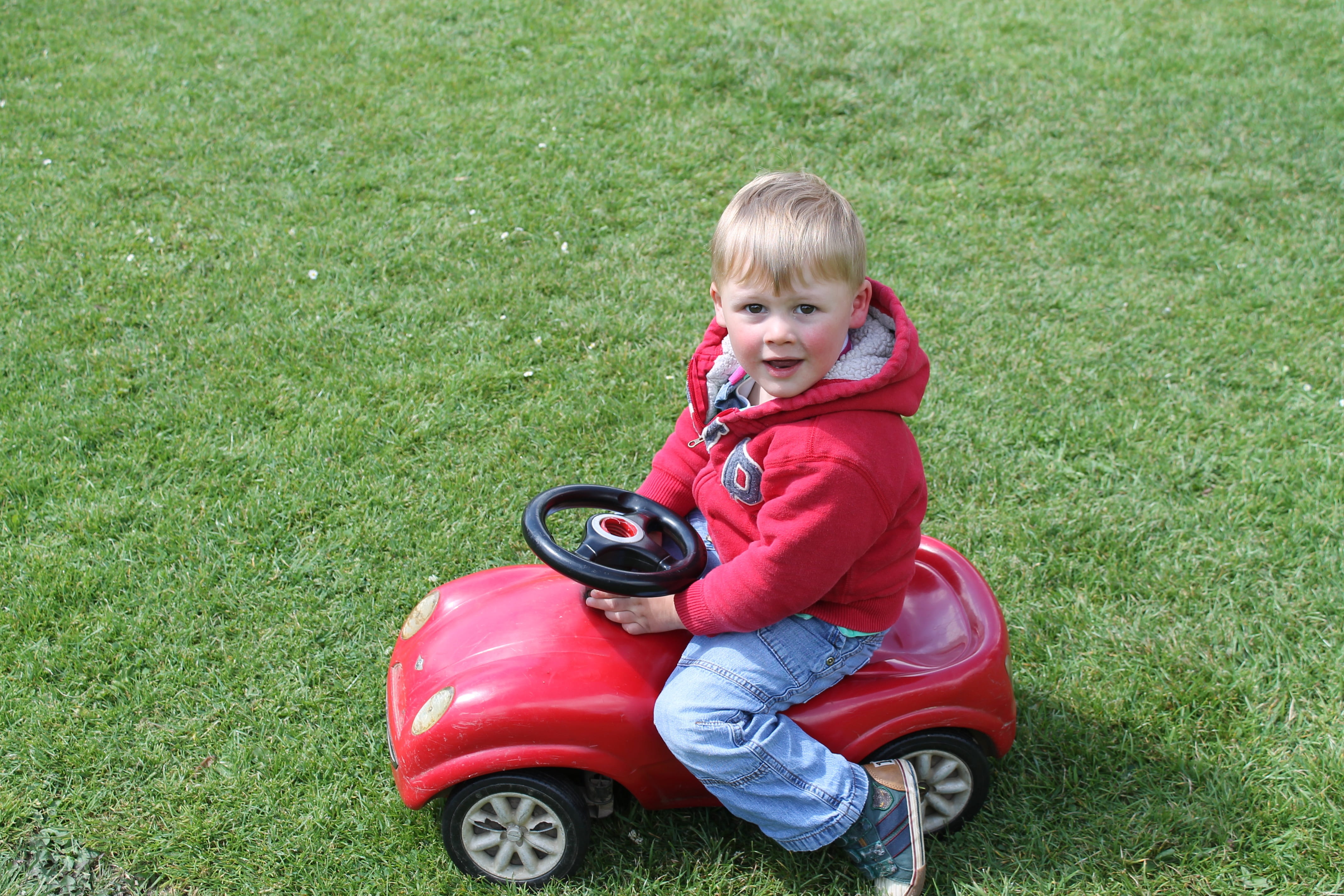 4K, day, full length, real people, Boy, males, Playtime, looking at camera, child, red, Toy Car, plant, portrait, Grass, cute, nature, hair, one person, HD Wallpaper