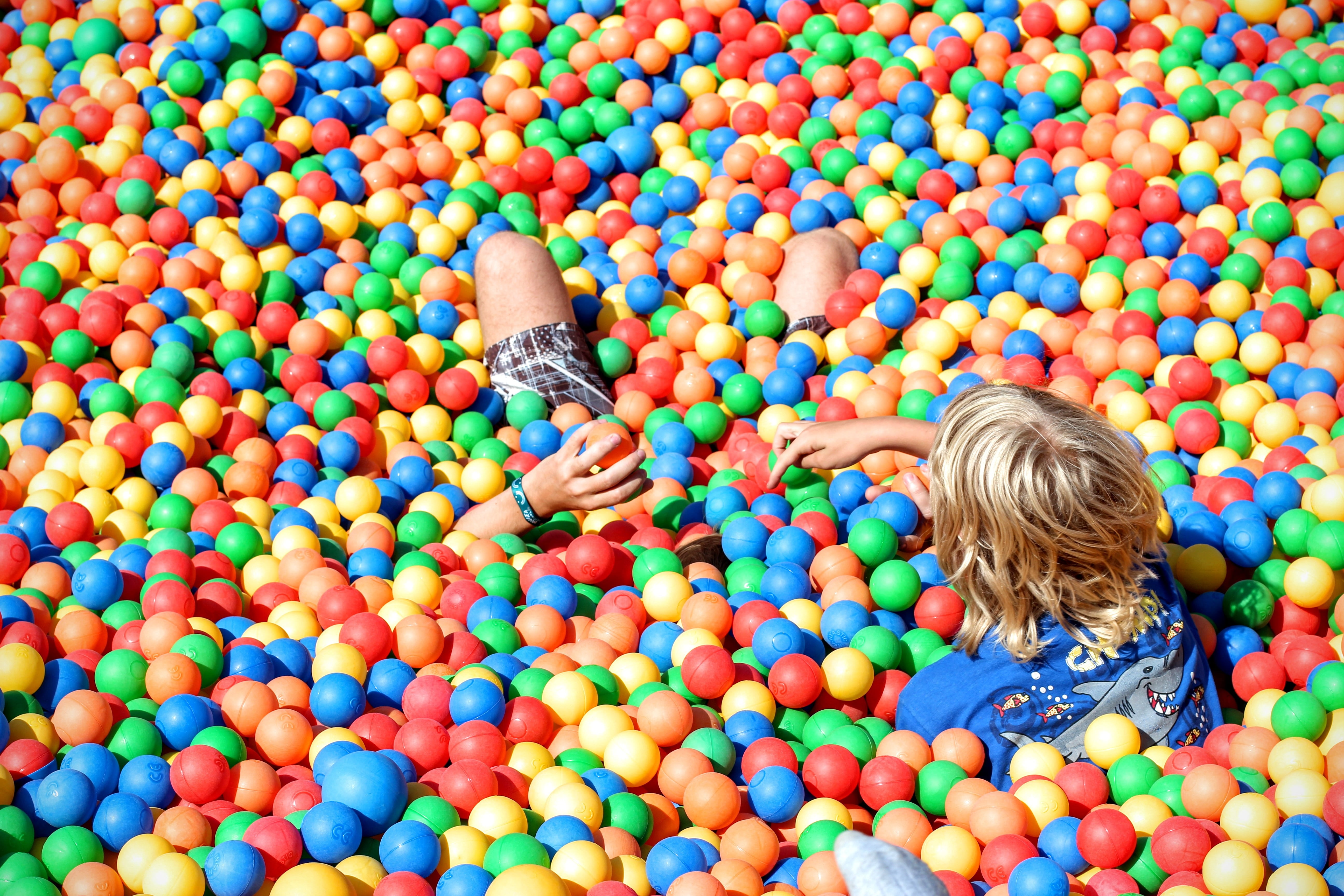 playing, childhood, enjoyment, ball pit, sister, fun, high angle view, innocence, yellow, togetherness, girls, play, men, hair, full length, blond hair, HD Wallpaper
