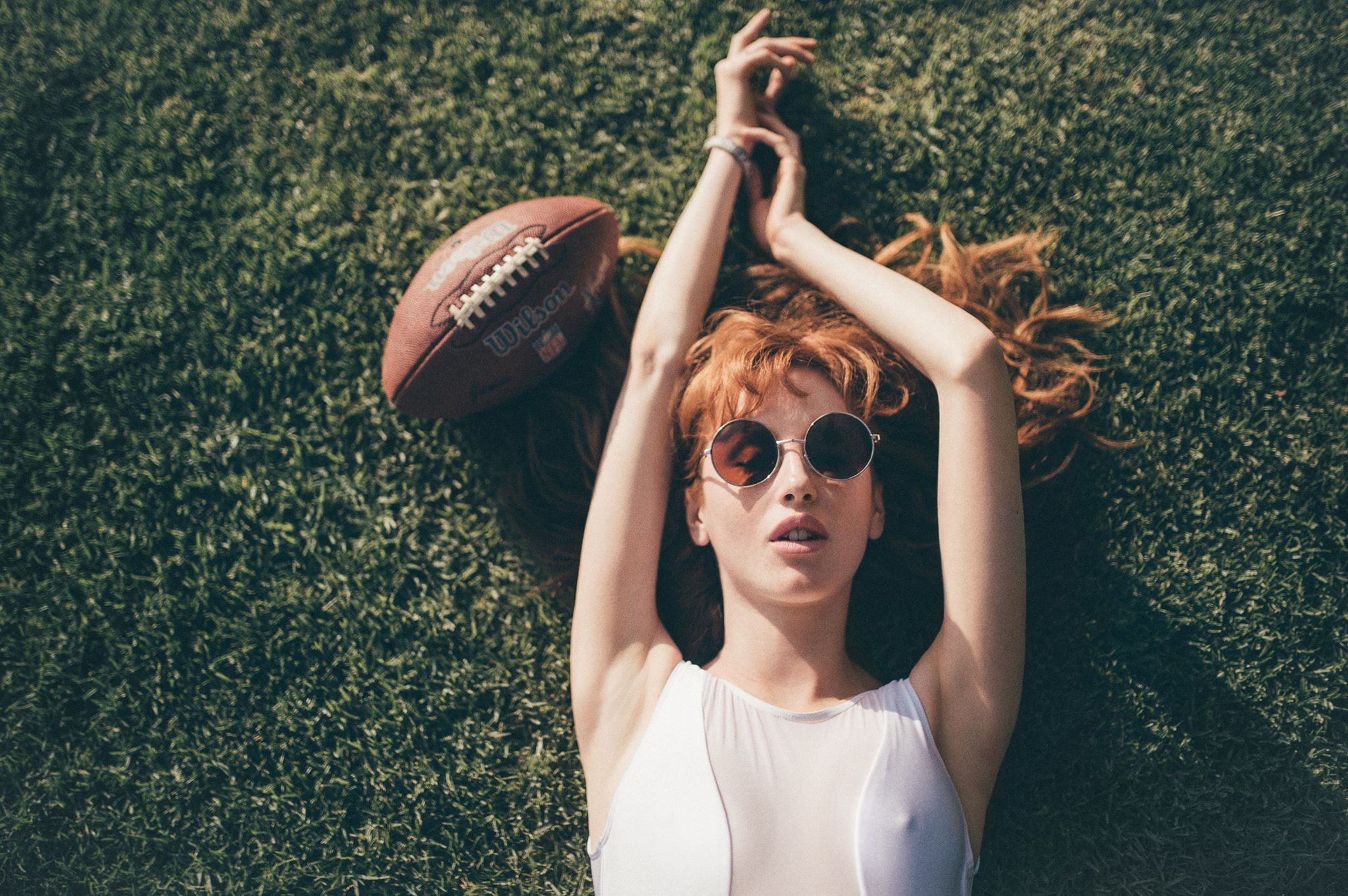 nature, sunglasses, looking at camera, casual clothing, lifestyles, glasses, lying on back, day, redhead, lying down, beautiful woman, American football, HD Wallpaper