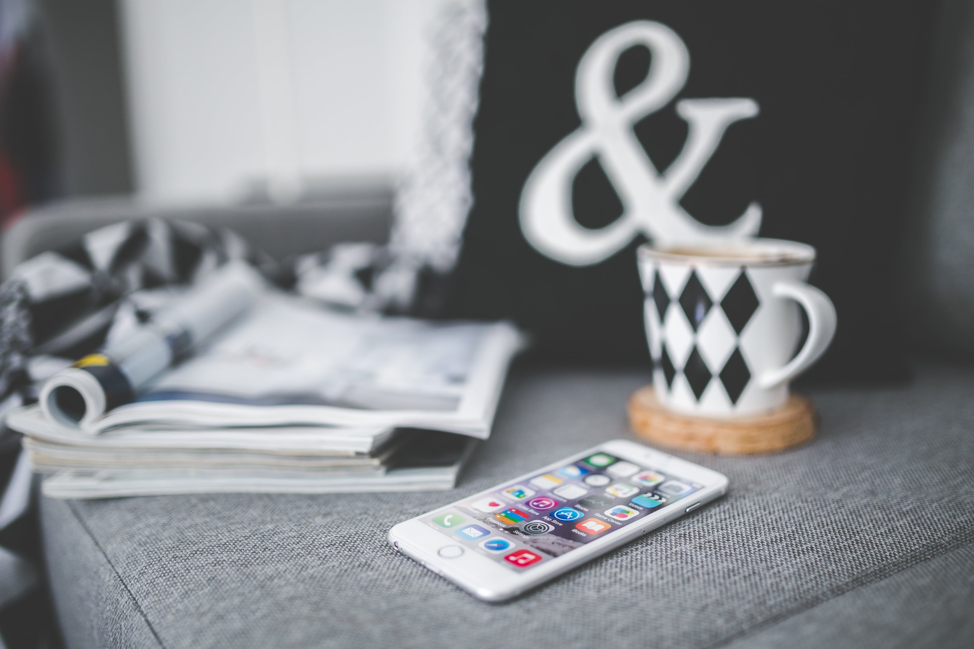 cup, day, screen, iphone 6, table, magazine, no people, apple, iphone 6 plus, stack, business, device, dollar sign, tech, home decor, group of objects, HD Wallpaper