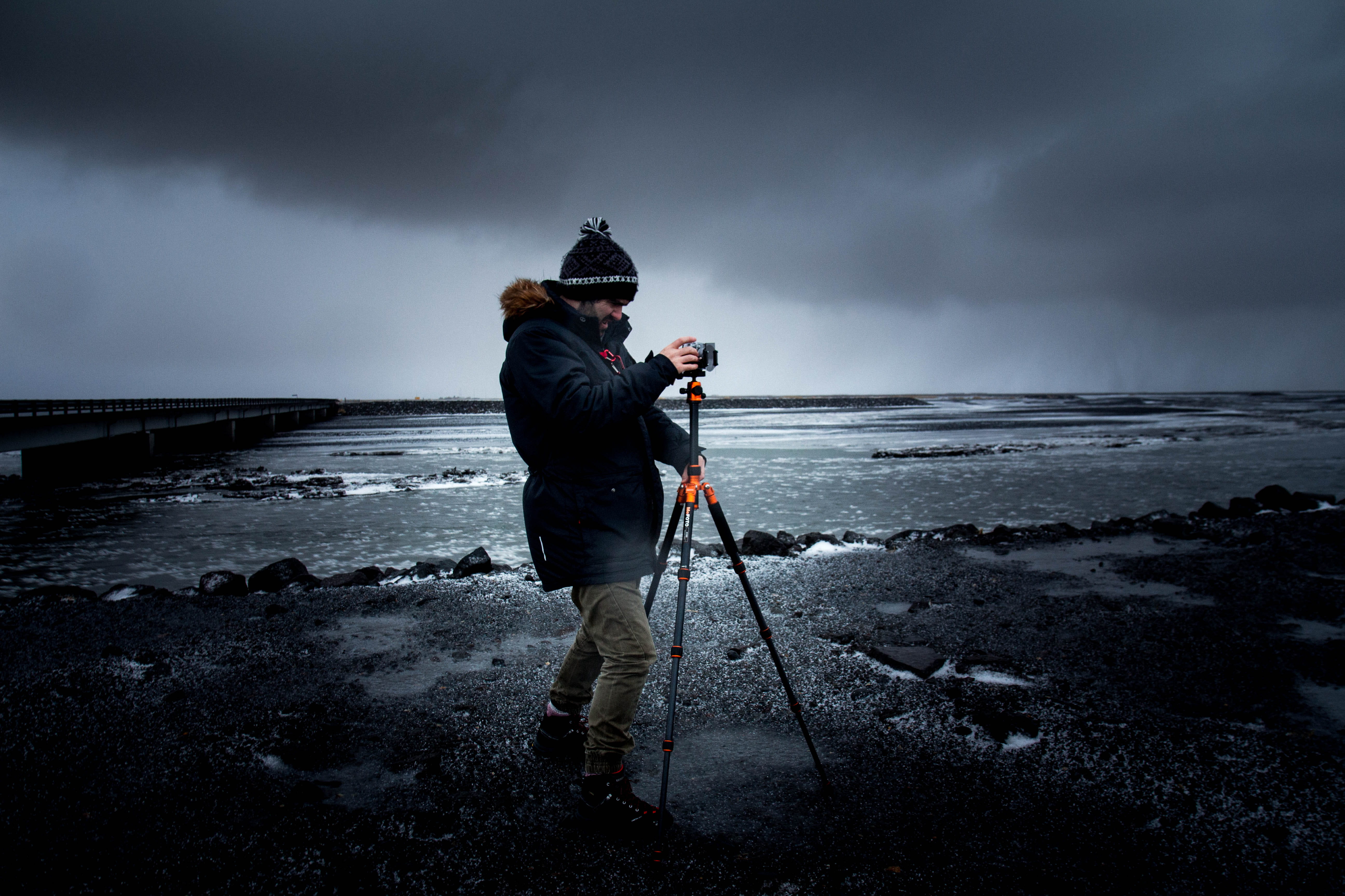 human, dark, tripod, wave, water, motion, iceland, using, 5K, sky, photography, holding, beach, taking, mood, photographer, standing, sea, land, storm cloud, HD Wallpaper