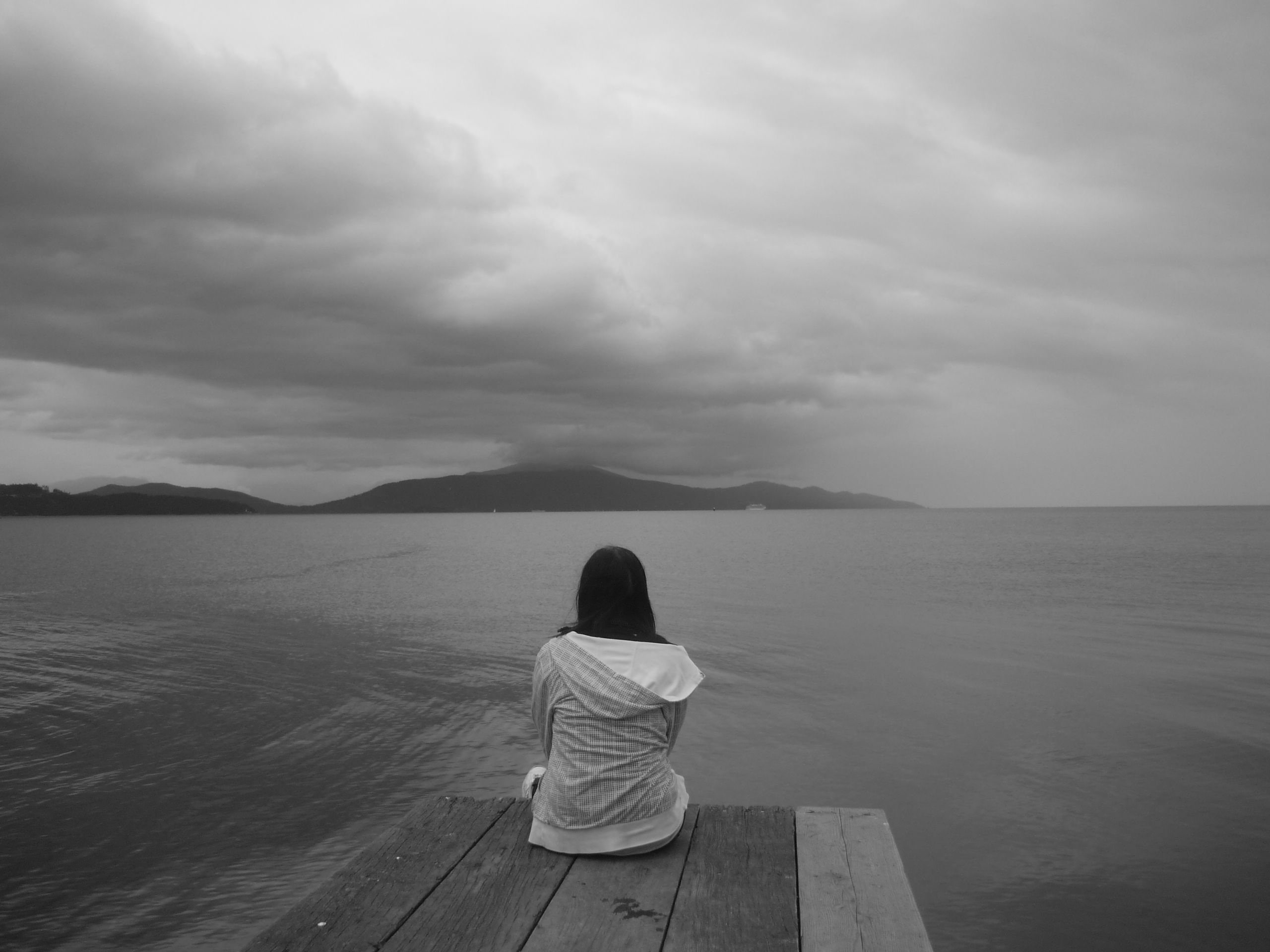 scenics - nature, lifestyles, leisure activity, hood - clothing, sitting, Dark, sea, depression, one person, sorrow, People, tranquility, women, outdoors, HD Wallpaper