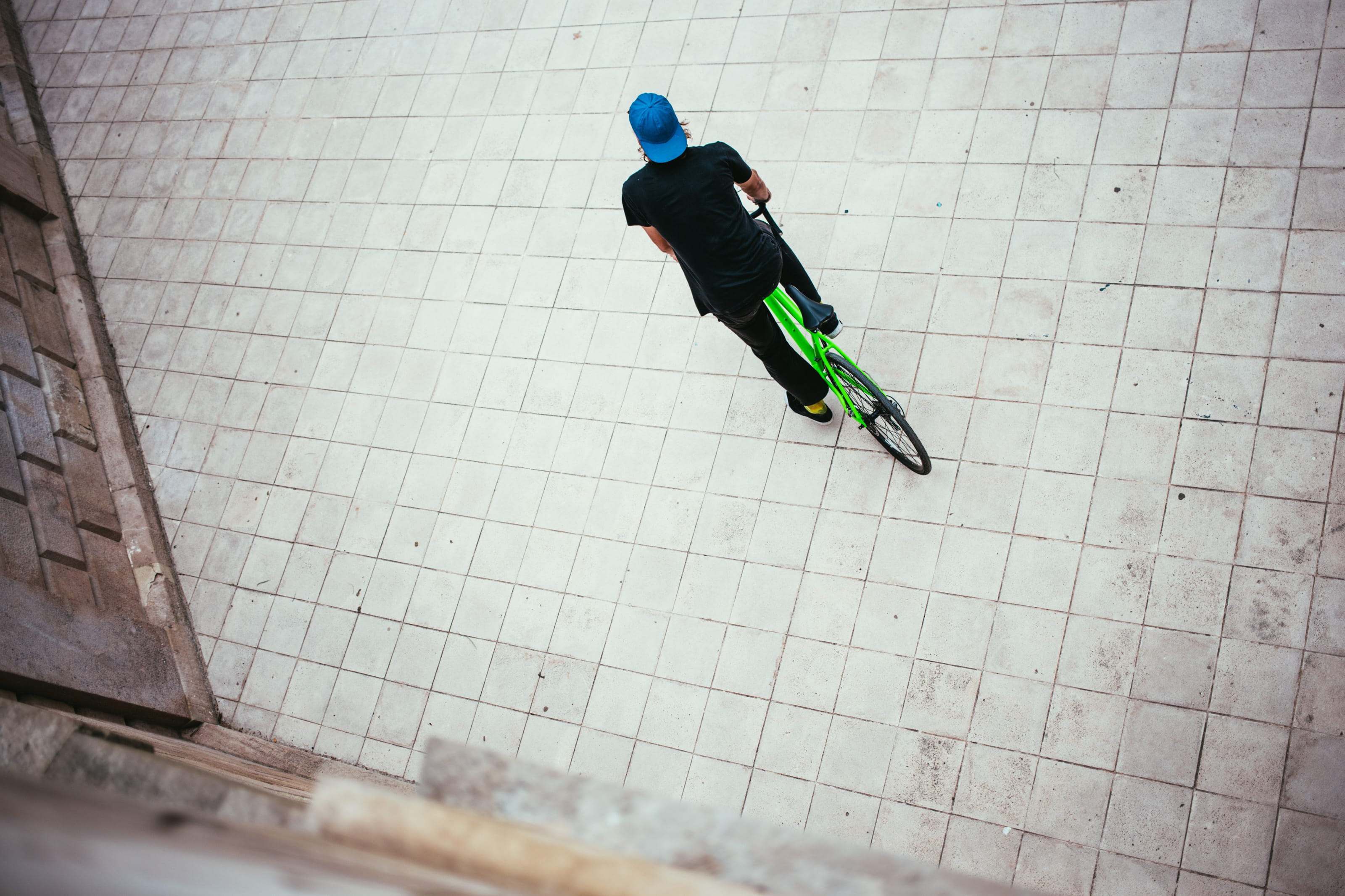 outdoors, cap, real people, caucasian, child, Wheel, Sport, riding, blue, men, 20-25 year old, tiled floor, cyclist, stylish, style, one person, mid-air, HD Wallpaper