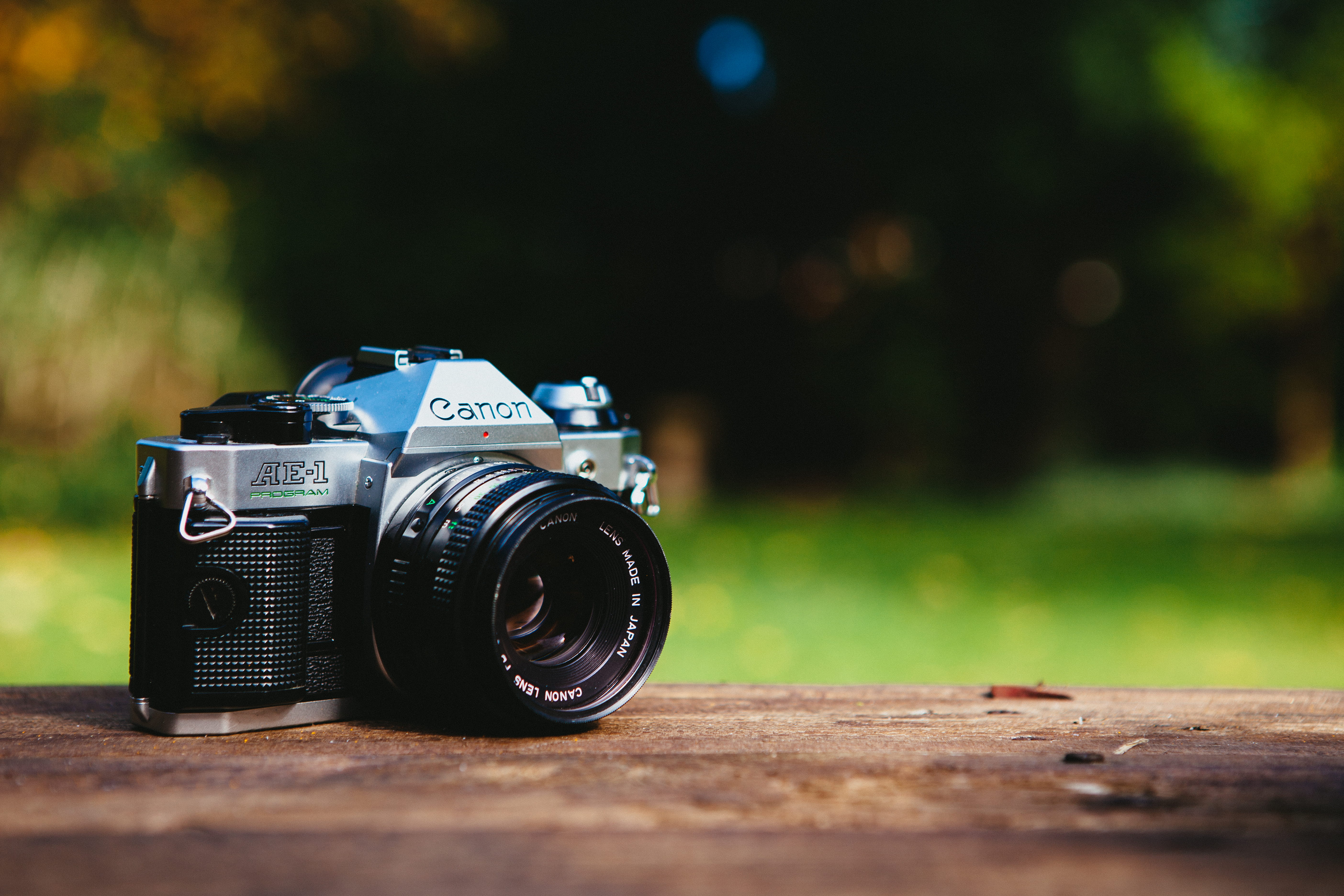 table, filming, focus on foreground, 5K, camera, nature, technology, wood - material, camera - photographic equipment, photography, ae-1, black, still life, HD Wallpaper