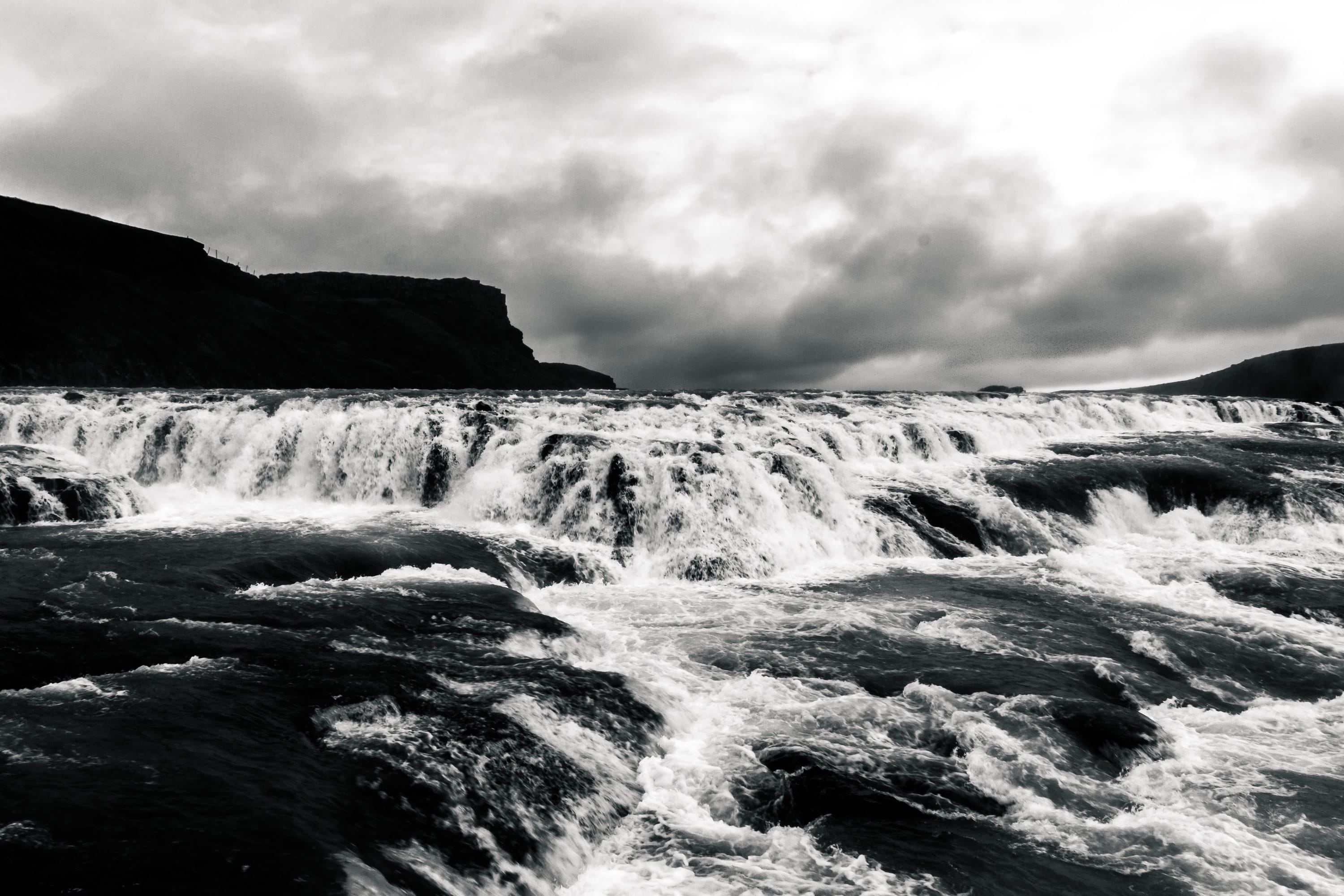 outdoors, 2K, sky, land, sea, black and white, nature, iceland, gullfoss, day, rock - object, flowing, flowing water, no people, motion, power in nature, HD Wallpaper