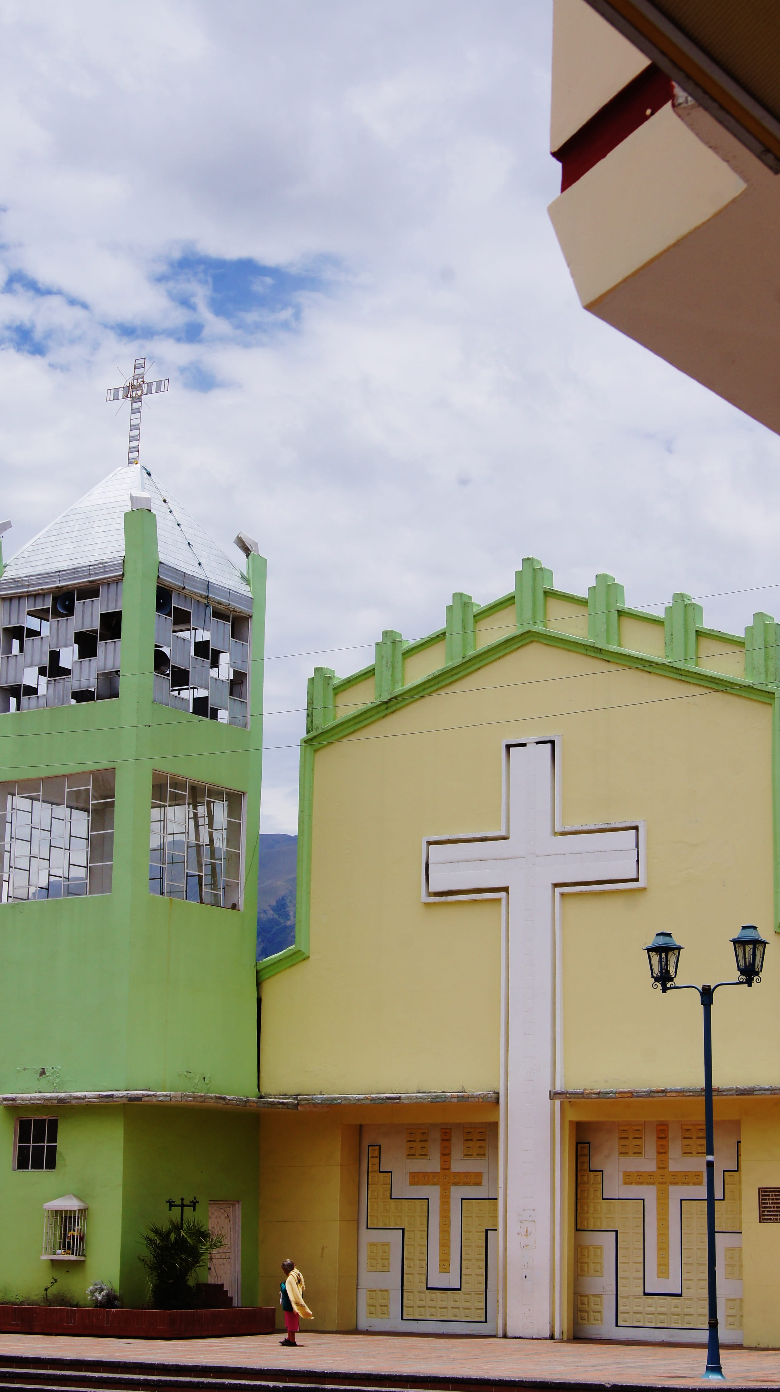 low angle view, crosses, mode of transportation, catholic, sky, city, baños de agua santa ecuador, day, colorful church, iglesia, built structure, lighting equipment, Phone HD Wallpaper