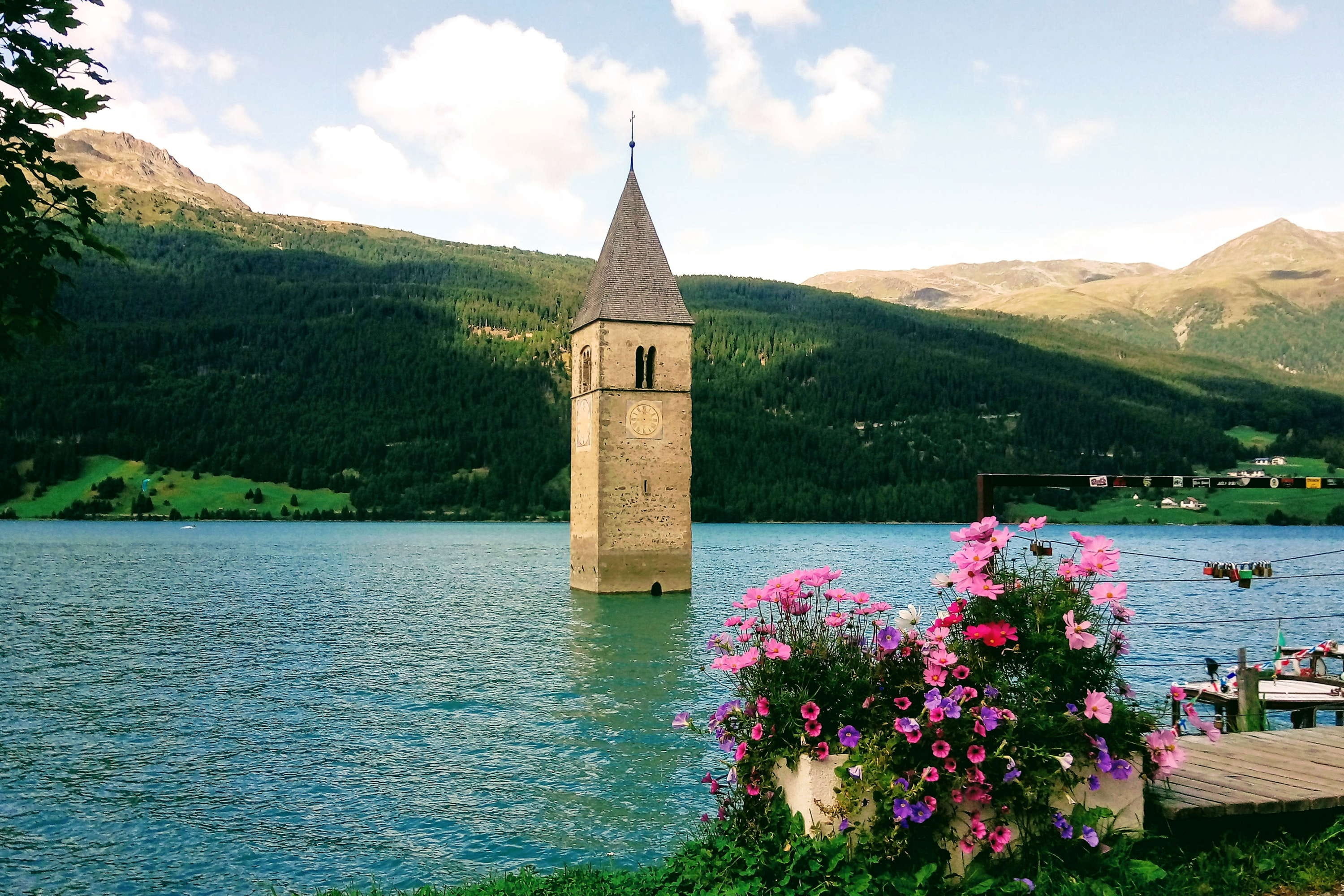 outdoors, no people, church, sky, nature, flower, beauty in nature, italy, 2K, tower, reschensee, religion, cloud - sky, mountains, flowering plant, lake, HD Wallpaper