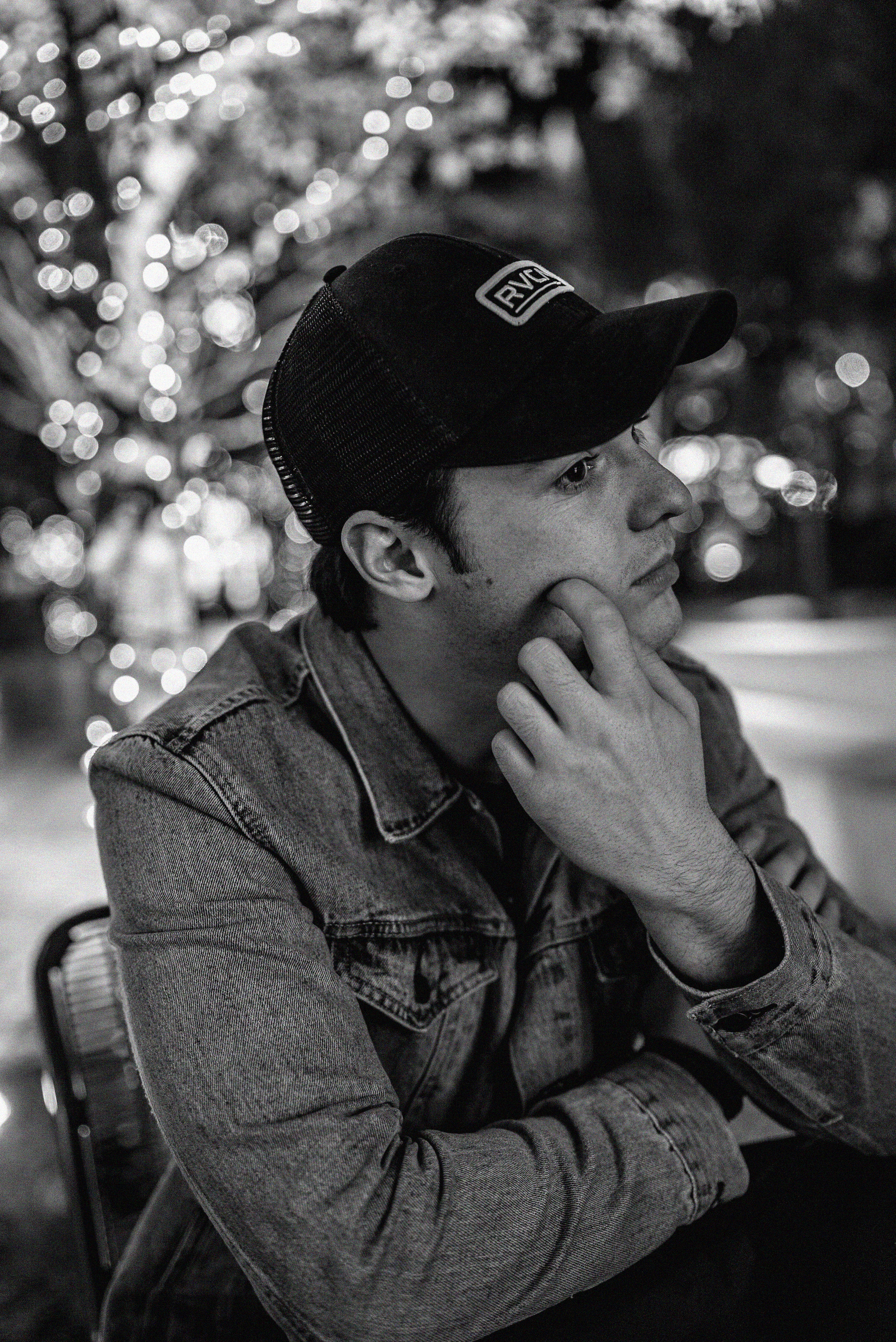 denim, real people, bokeh, hat, looking away, portrait, man, front view, looking, focus on foreground, monochrome, leisure activity, jacket, seat, innocence, Phone HD Wallpaper
