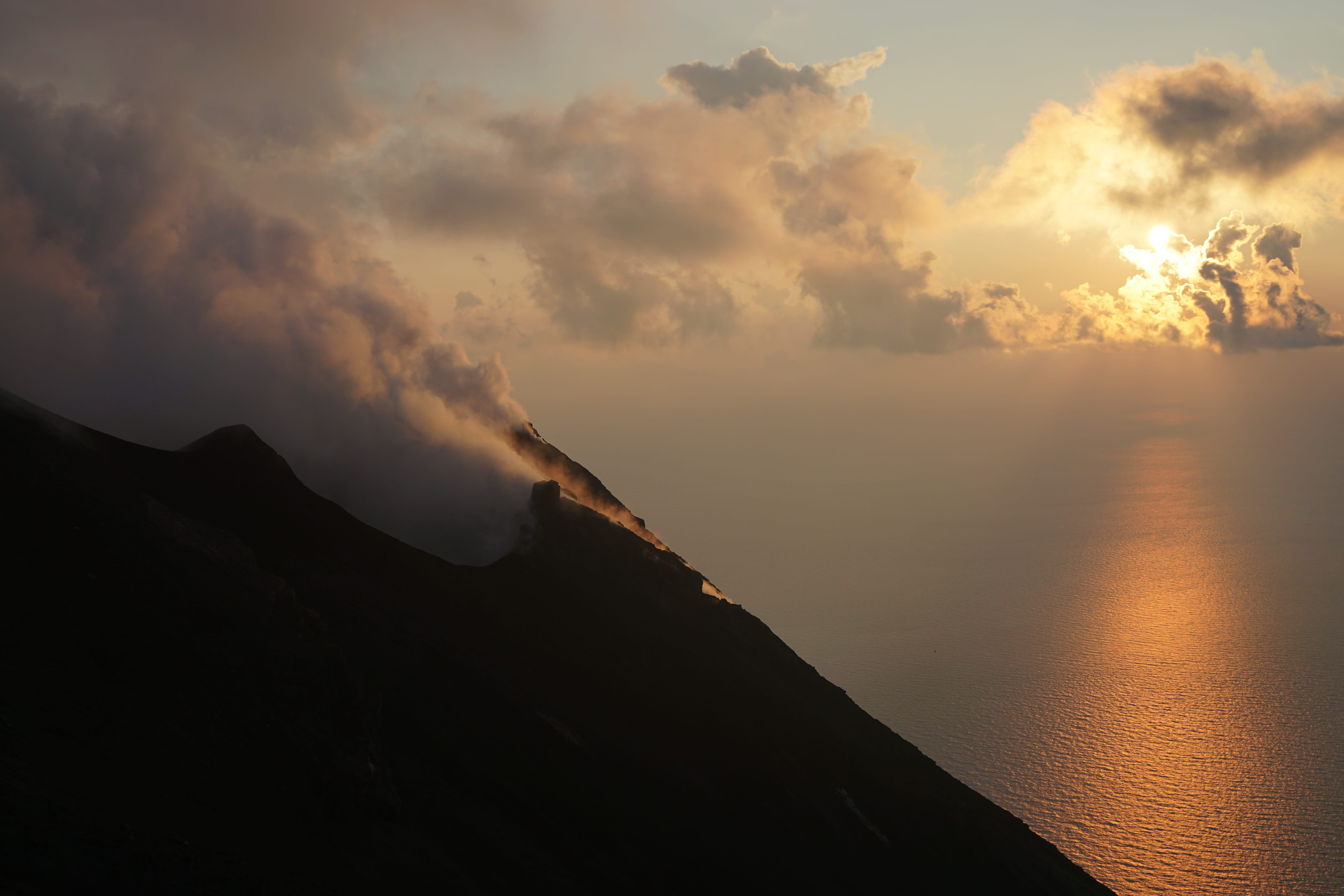 smoke, sunset, clouds, sea, mountain, orange, non-urban scene, water, volcano, distance, sky, smoke - physical structure, near, tranquil scene, evening, HD Wallpaper