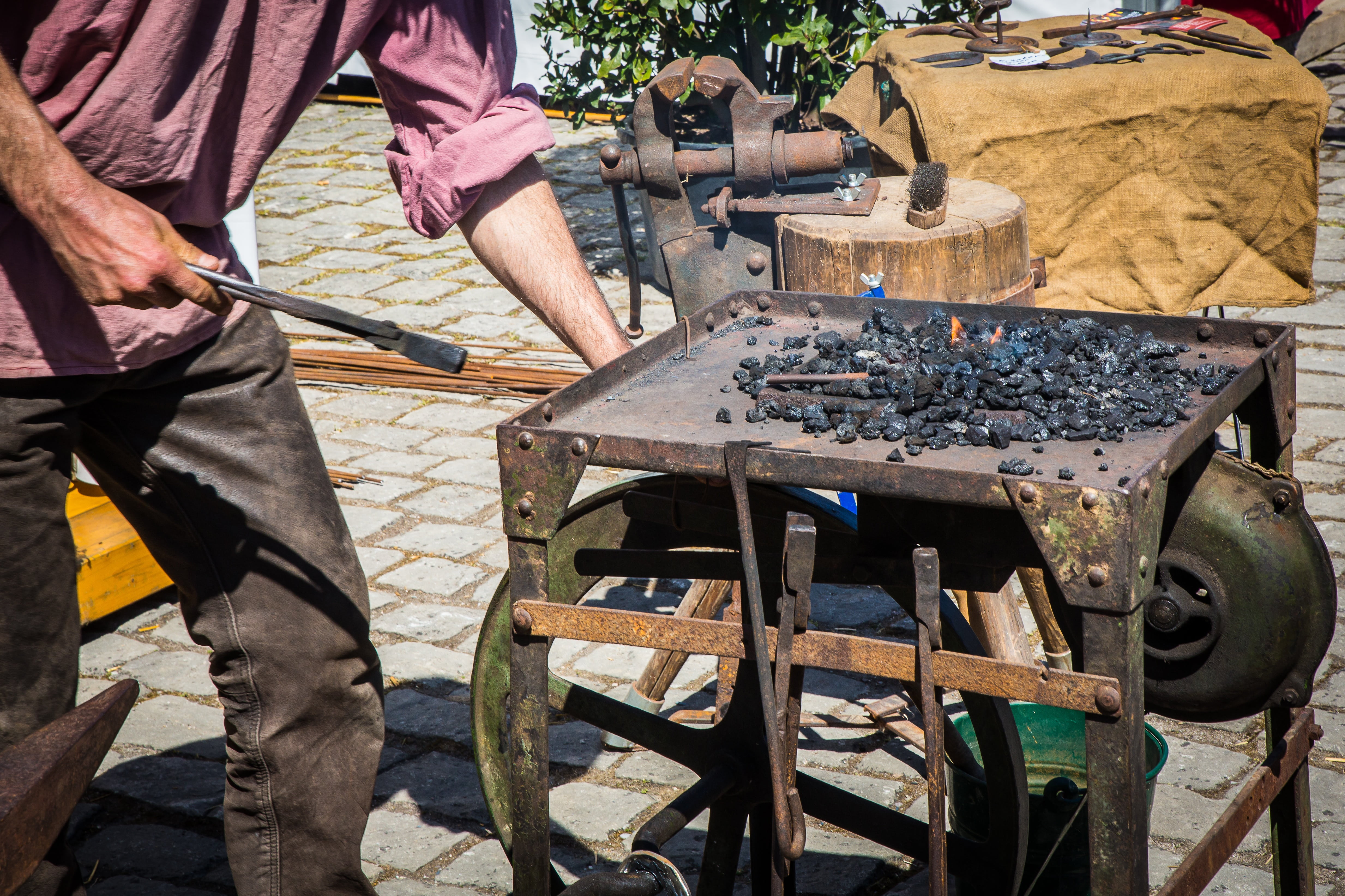 real people, holding, forge, low section, sunlight, men, flame, glow, human hand, day, wood - material, working, hand, blacksmith, iron, human body part, HD Wallpaper
