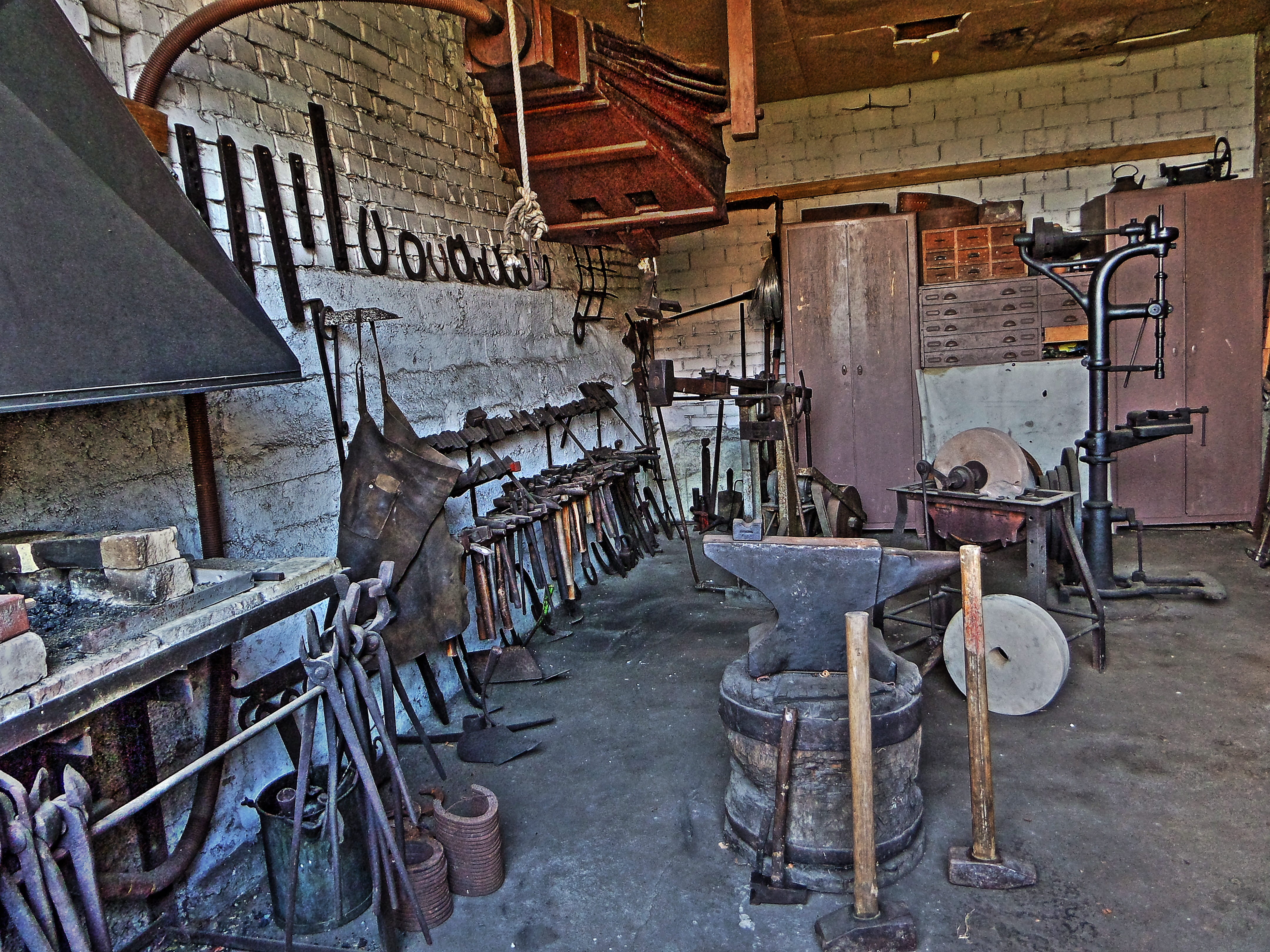 in a row, wall, large group of objects, no people, Workshop, blacksmith, still life, 4K, seat, chair, table, old, anvil, abandoned, bunch, Forge, day, HD Wallpaper