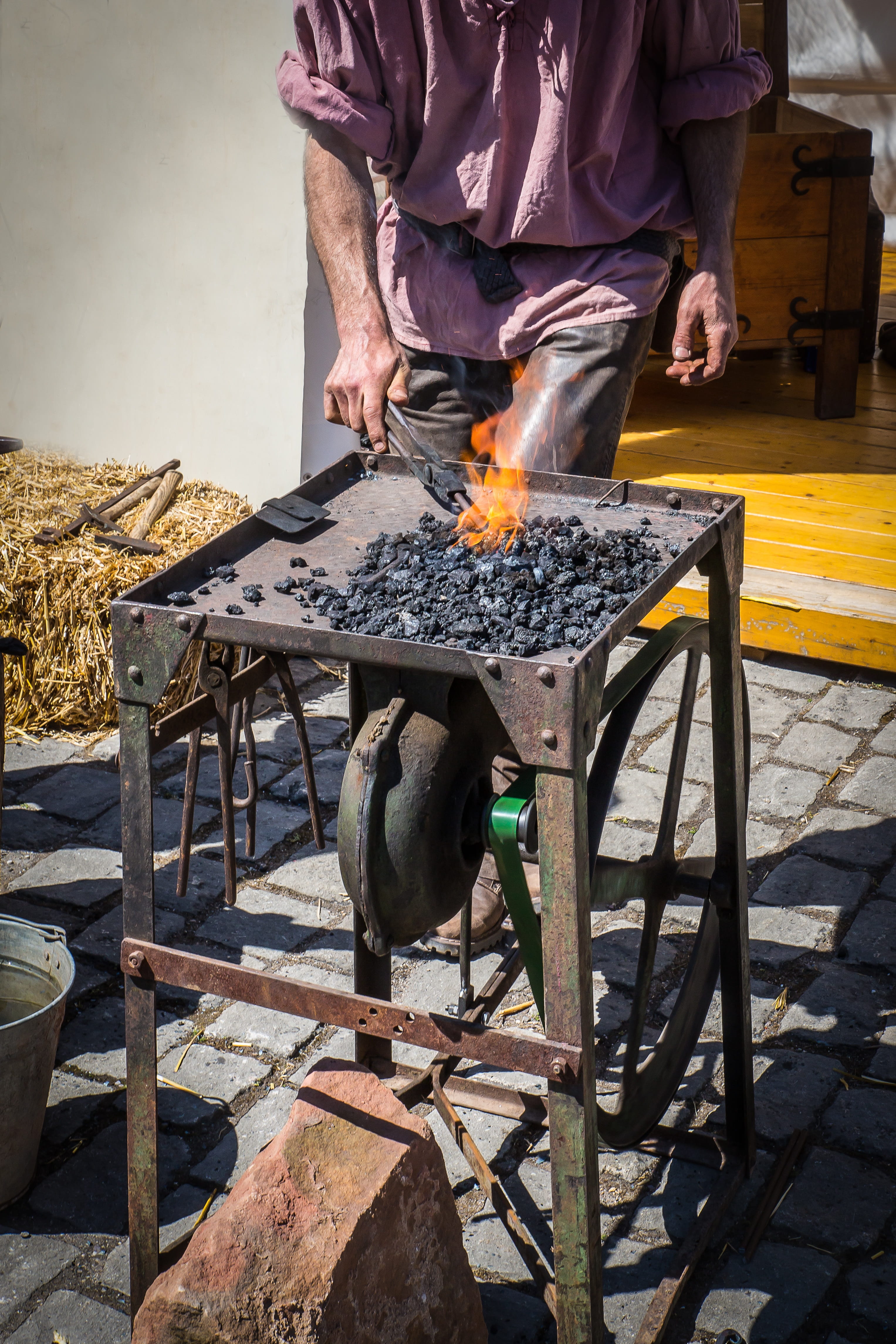 heat - temperature, flame, one person, fire - natural phenomenon, skill, one man only, Blacksmith, midsection, fire, occupation, holding, Iron, sunlight, Phone HD Wallpaper