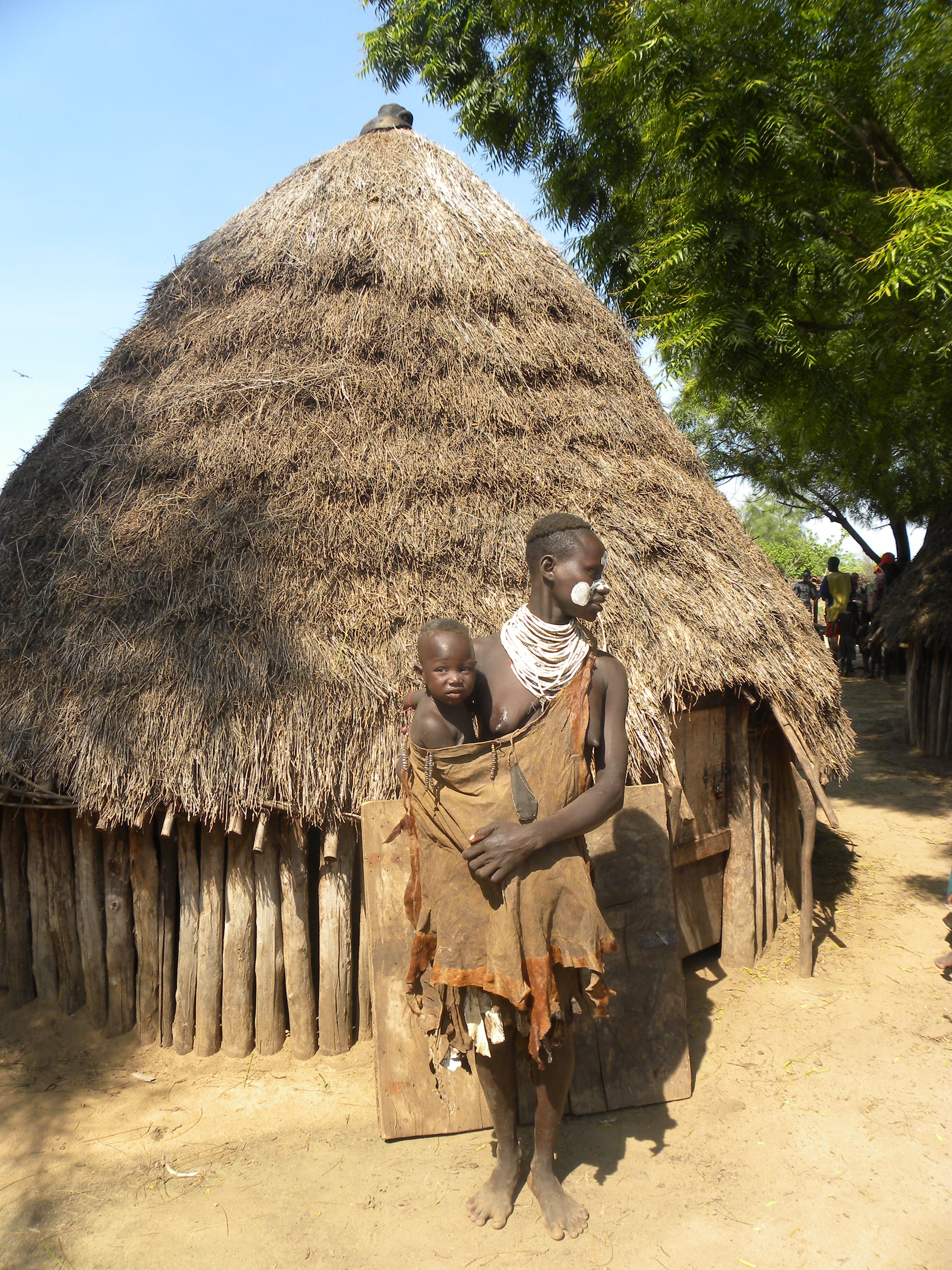 real people, two people, thatched roof, outdoors, tree, architecture, hut, men, travel, day, ethiopia, plant, land, built structure, sitting, roof, cottage, Phone HD Wallpaper