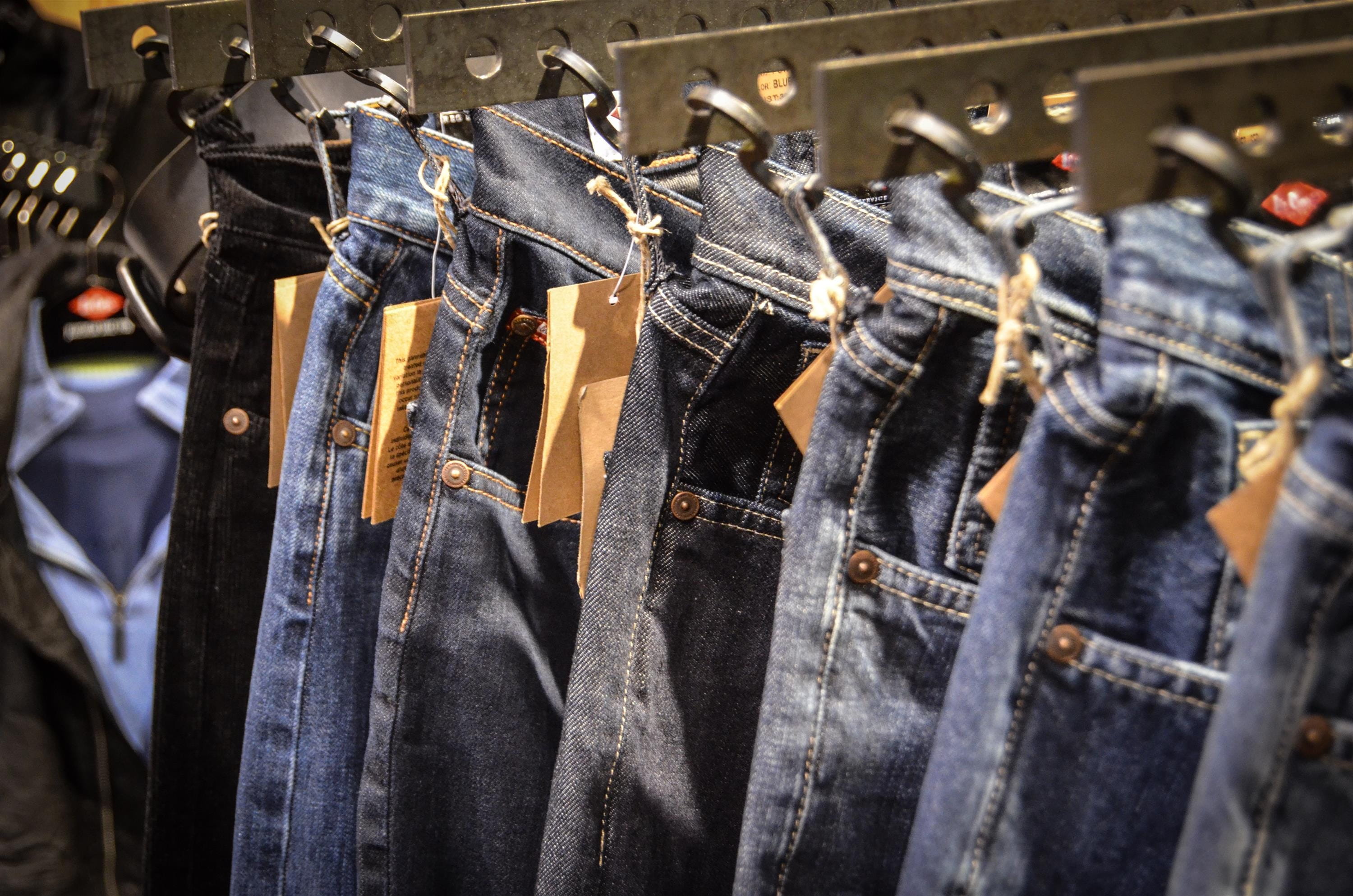 store, pants, no people, choice, coathanger, business, jeans, hanging, metal, fashion, blue, large group of objects, clothing, clothes, shelf, arrangement, HD Wallpaper