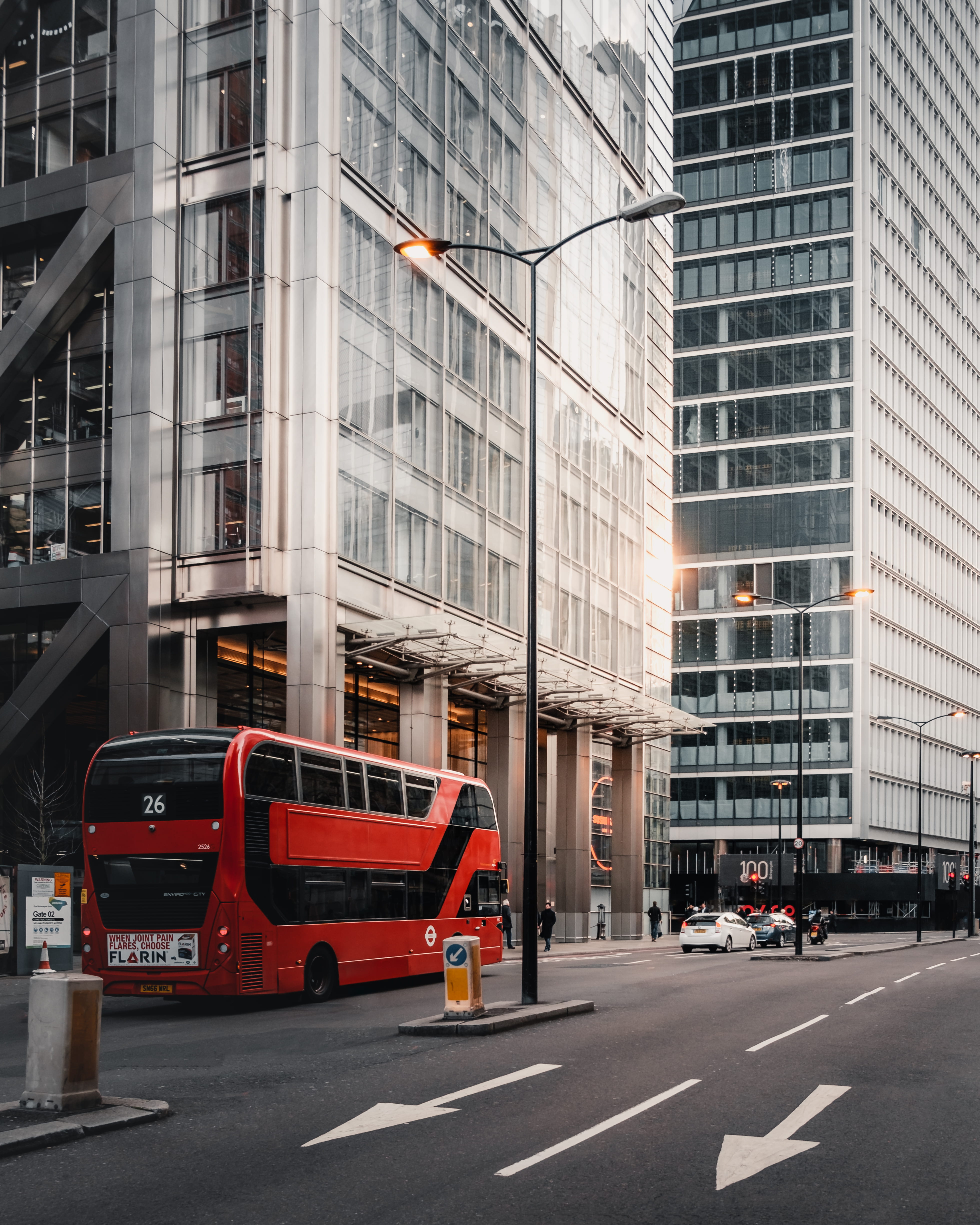 human, sign, vehicle, 4K, bus, town, asphalt, office building exterior, urban, skyscraper, no people, building exterior, motion, mode of transportation, Phone HD Wallpaper