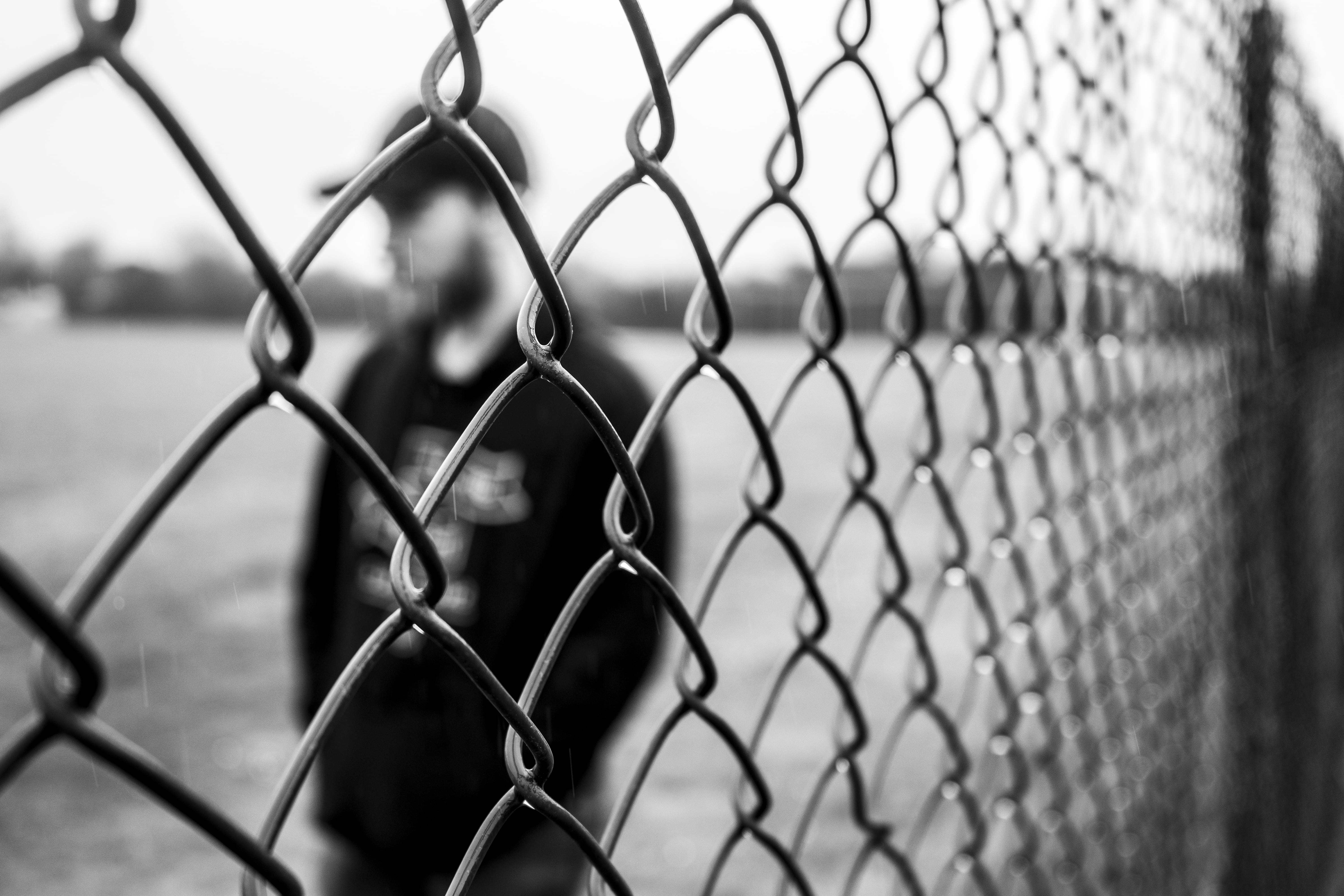 protection, playing field, chainlink fence, selective focus, sport, safety, barrier, sky, man, clear sky, crisscross, black and white, truro, united kingdom, HD Wallpaper